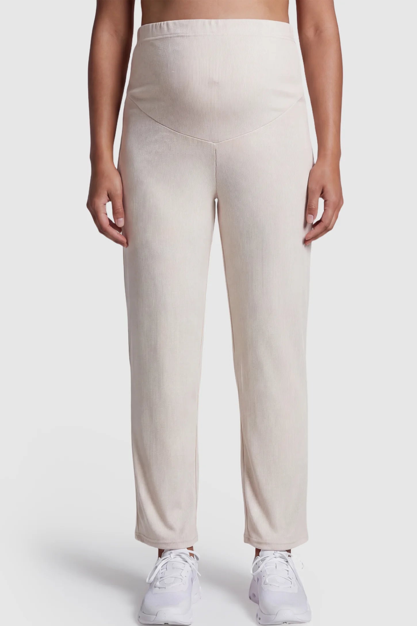 Adjustable Elastic Waist Straight Leg Maternity Pants Straight Leg Maternity Pants in light apricot featuring an adjustable elastic waist on a pregnant model.