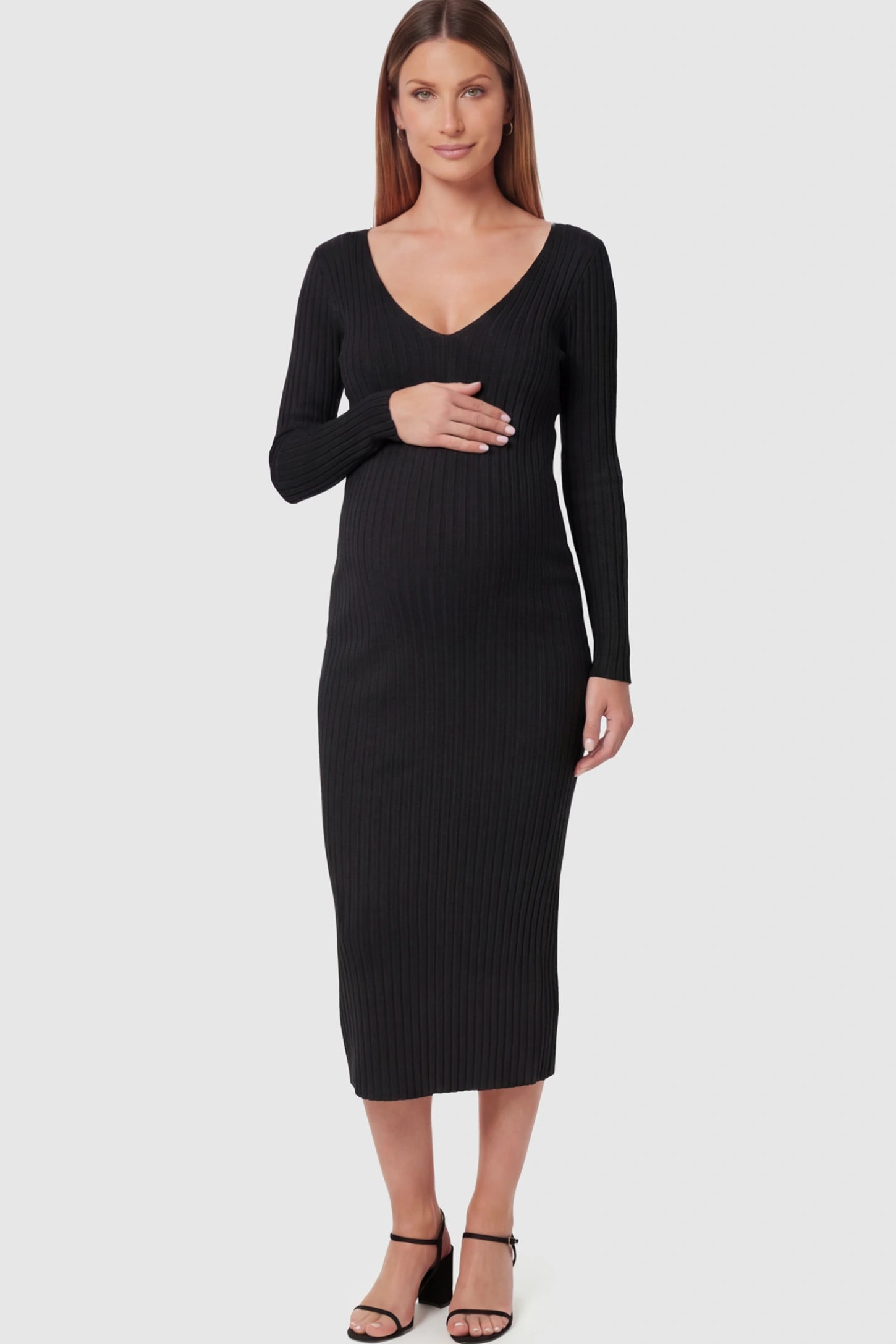 Ribbed V-Neck Maternity Midi Dress in Black featuring a fitted long sleeve on a pregnant model.