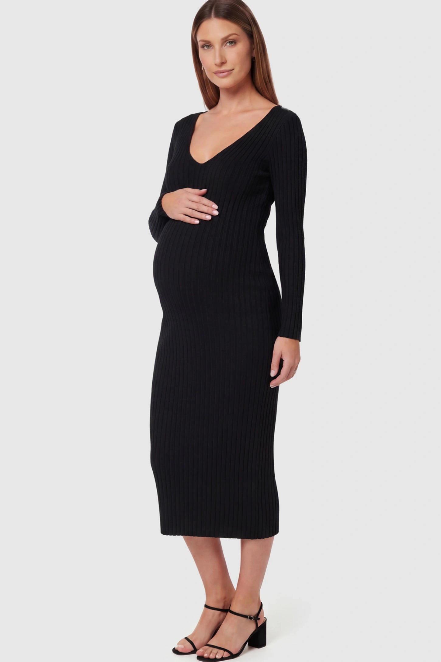 Ribbed V-Neck Maternity Midi Dress in Black featuring a fitted long sleeve on a pregnant model.