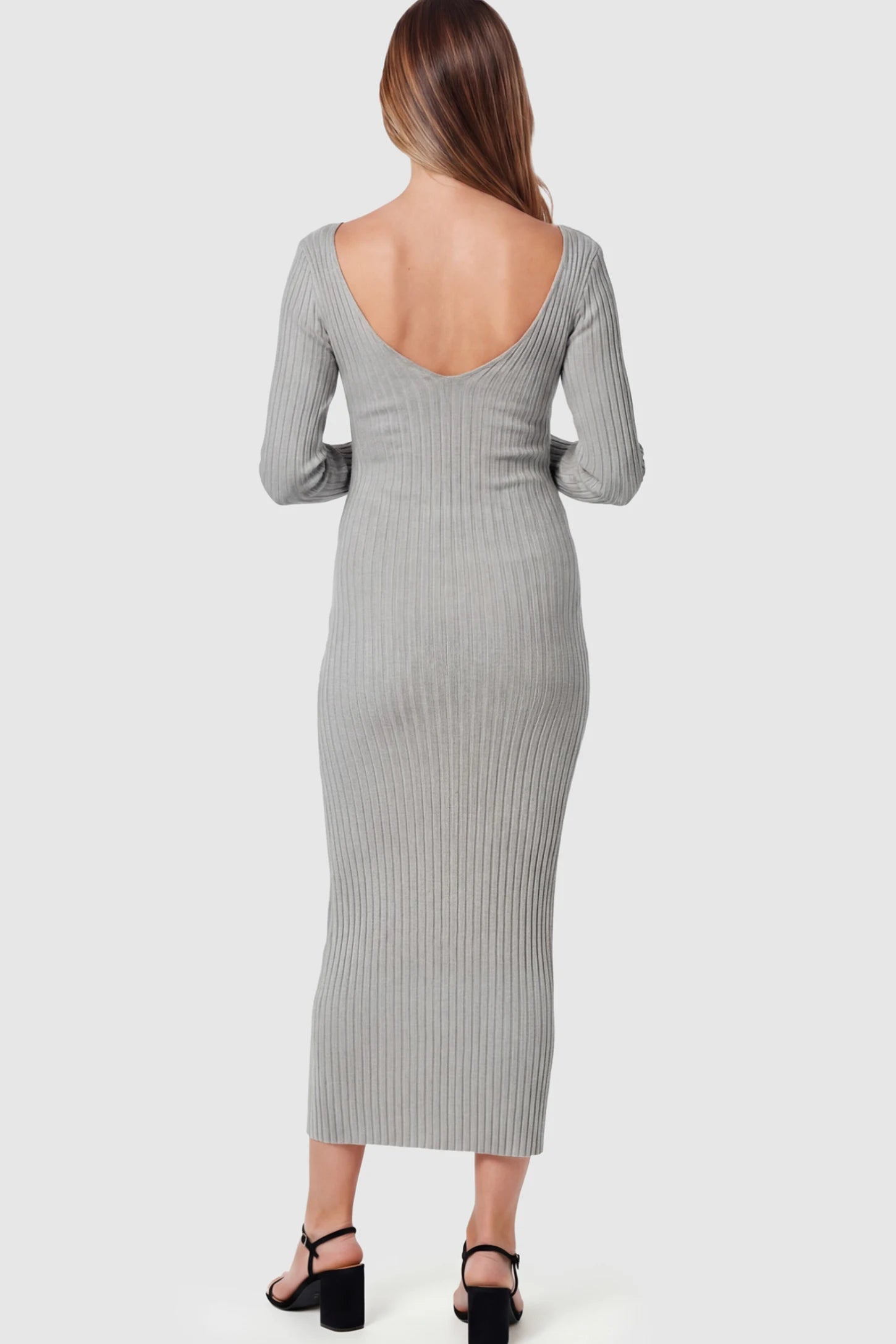 Ribbed V-Neck Long Sleeve Maternity Midi Dress Ribbed V-Neck Maternity Midi Dress in Gray featuring a fitted long sleeve on a pregnant model.