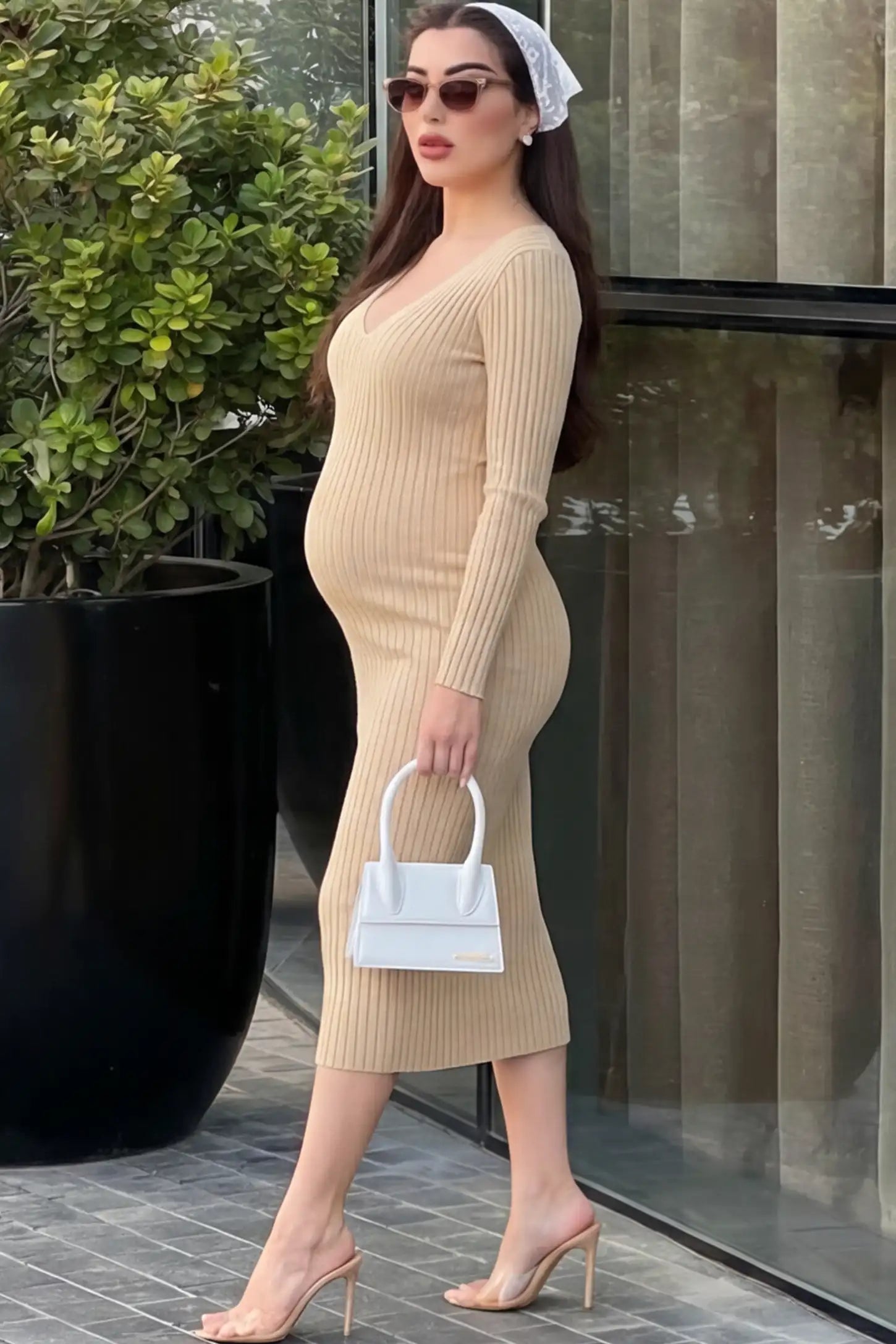 Ribbed V-Neck Long Sleeve Maternity Midi Dress Ribbed V-Neck Maternity Midi Dress in Khaki featuring a fitted long sleeve on a pregnant model.