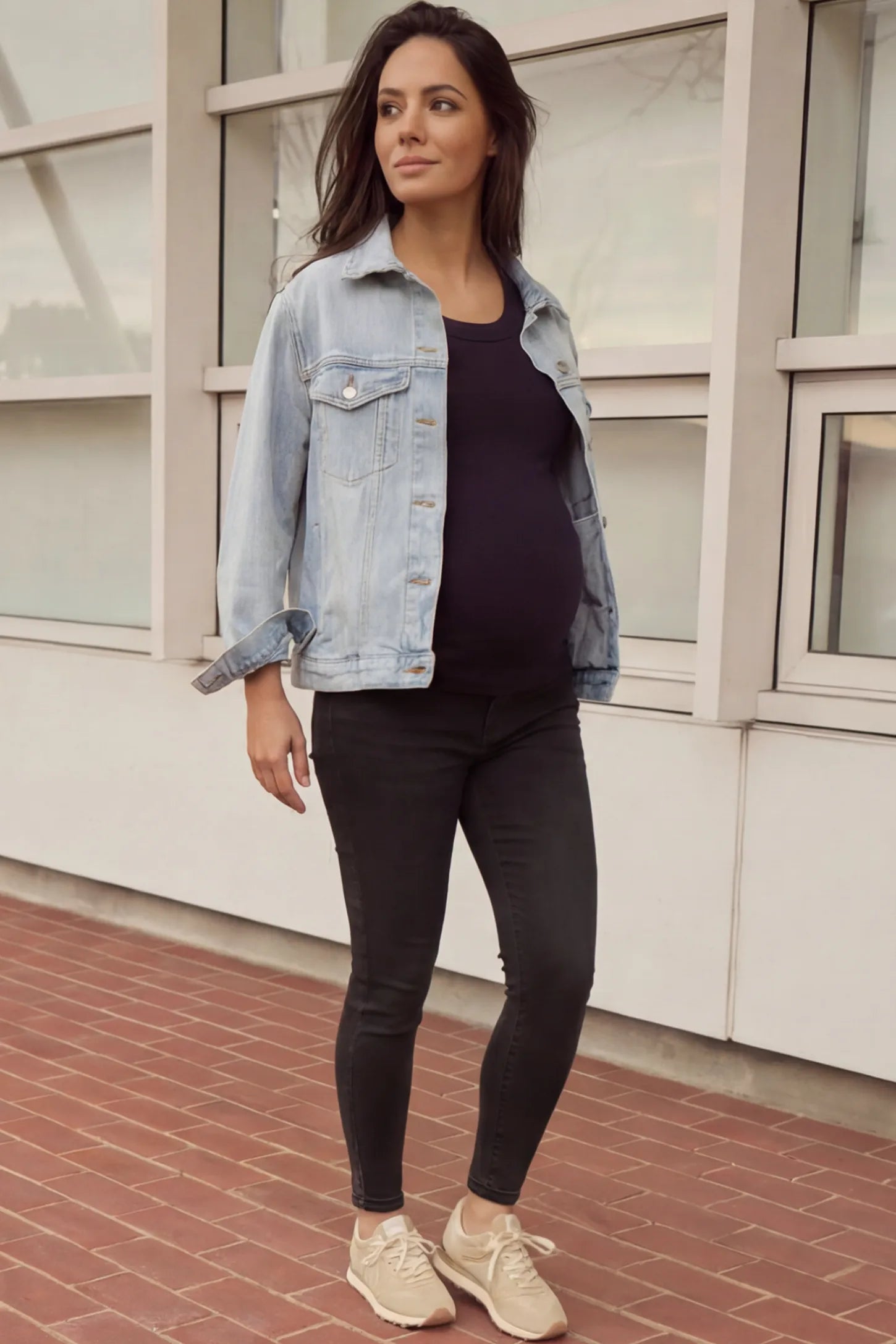 Full Panel Released Hem Maternity Skinny Jeans Full Panel Released Hem Maternity Skinny Jeans in Black featuring a released hem and over-the-belly panel on a pregnant woman.