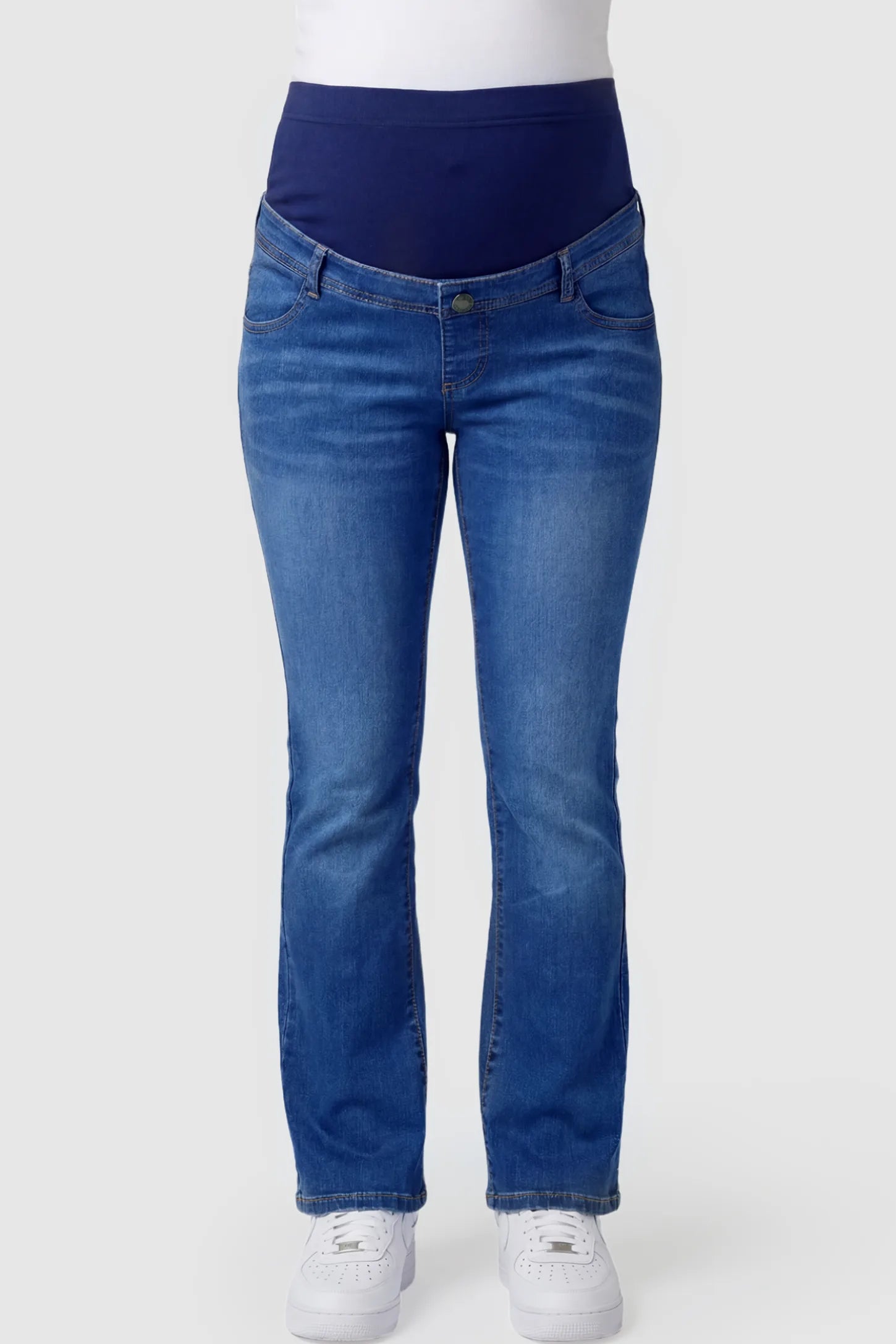 Full Panel Bootcut Maternity Jeans in medium wash blue featuring a stretchy over-the-belly panel on a pregnant model.