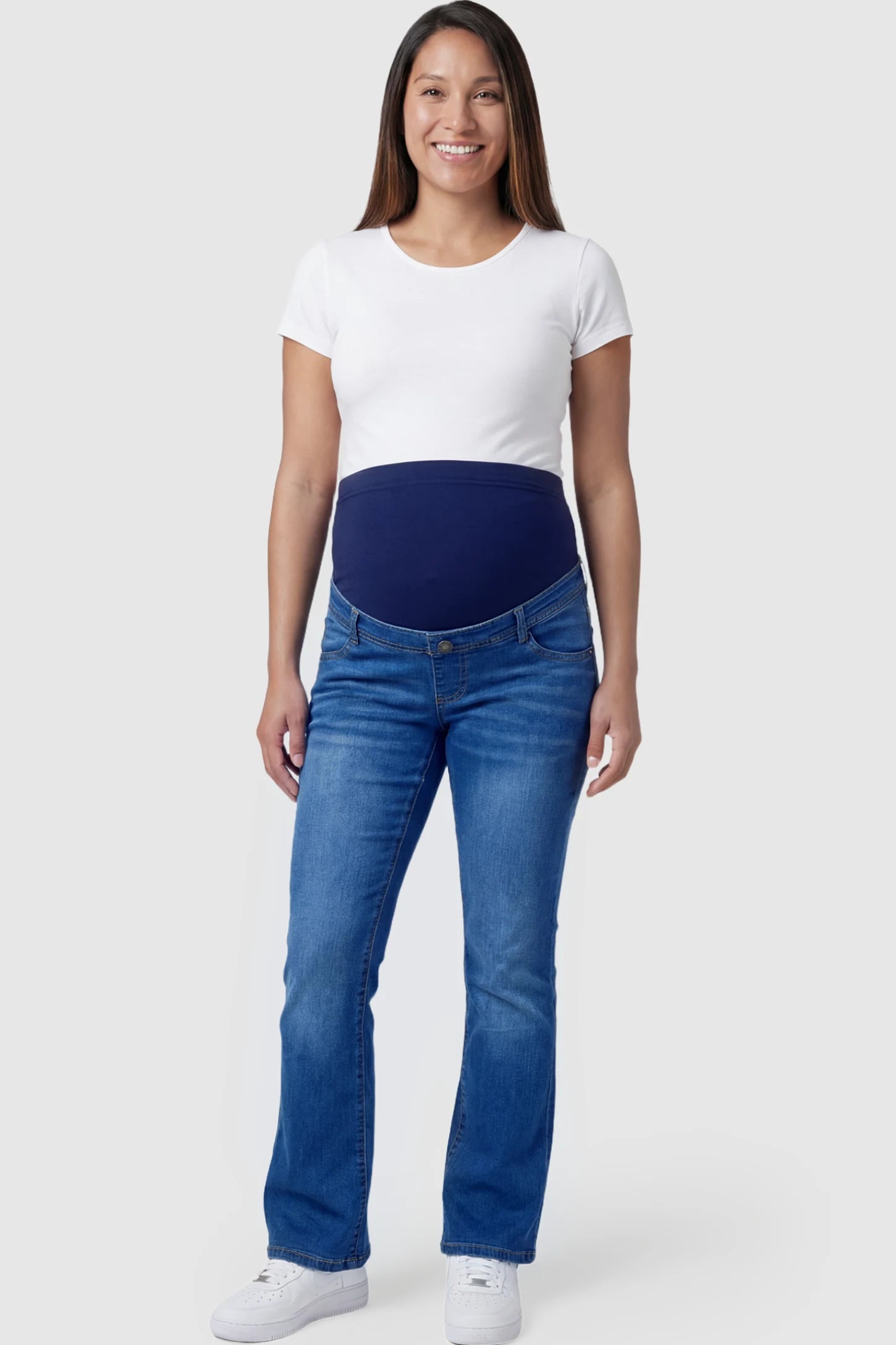 Full Panel Bootcut Maternity Jeans in medium wash blue featuring a stretchy over-the-belly panel on a pregnant model.