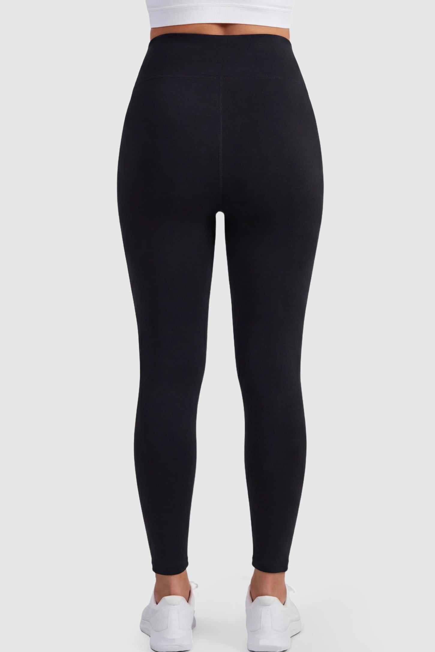 Full Panel Slim Fit Maternity Leggings Full Panel Slim Fit Maternity Leggings in Black featuring a seamless over-the-belly waistband on a pregnant model showing back.