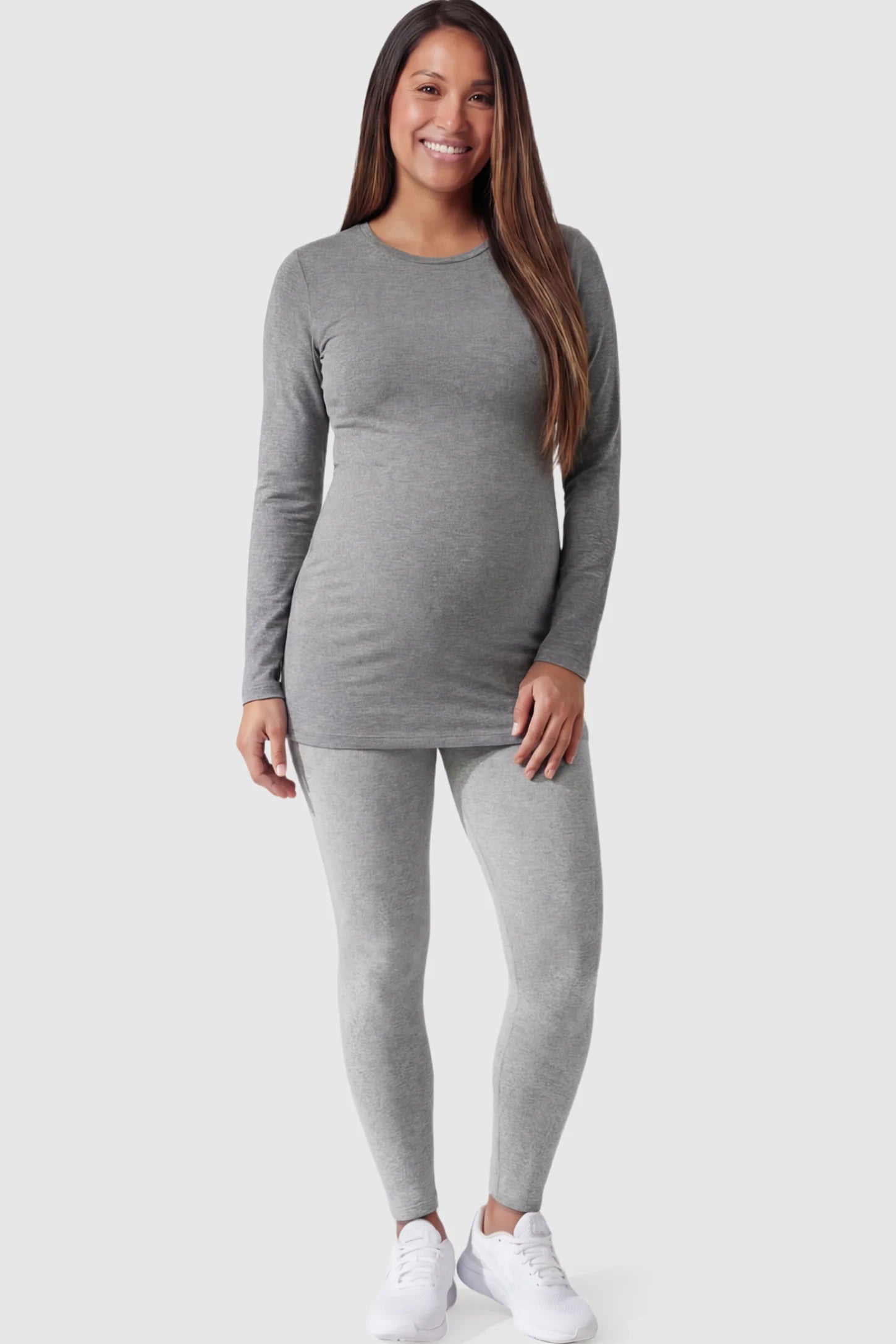 Full Panel Slim Fit Maternity Leggings Full Panel Slim Fit Maternity Leggings in Light Gray featuring a seamless over-the-belly waistband on a pregnant model facing front.
