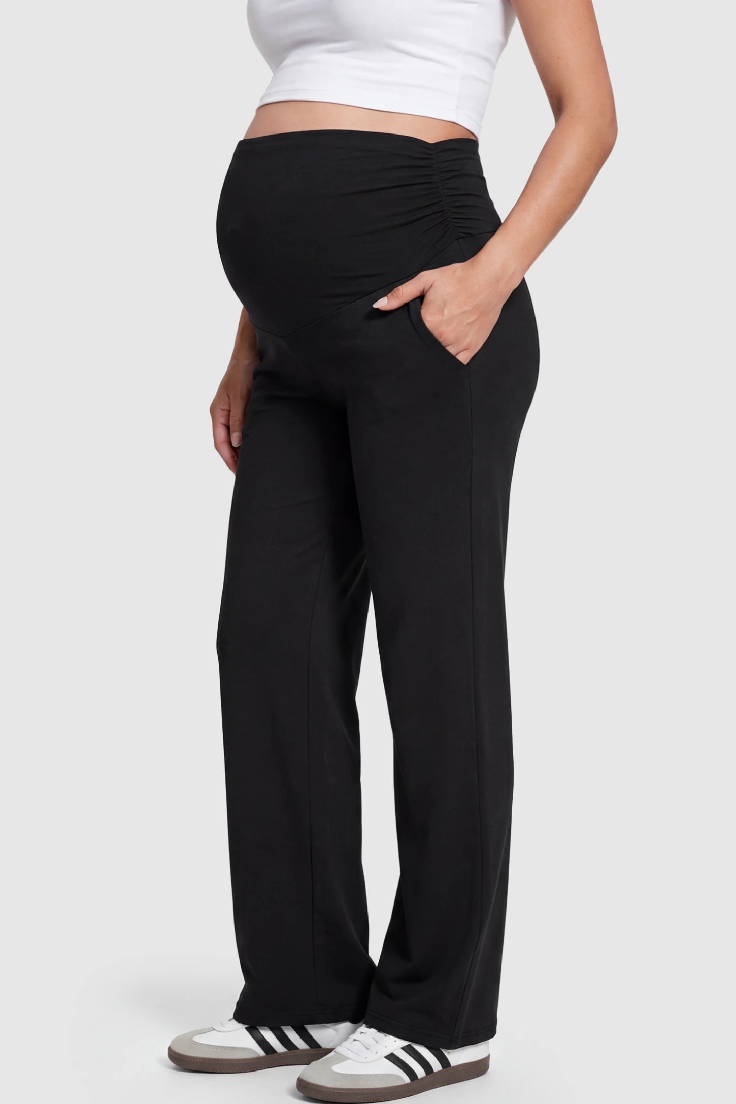 Ruched Full Panel Wide Leg Maternity Pants Ruched Full Panel Wide-Leg Maternity Pants in Black featuring side pockets on a pregnant model.