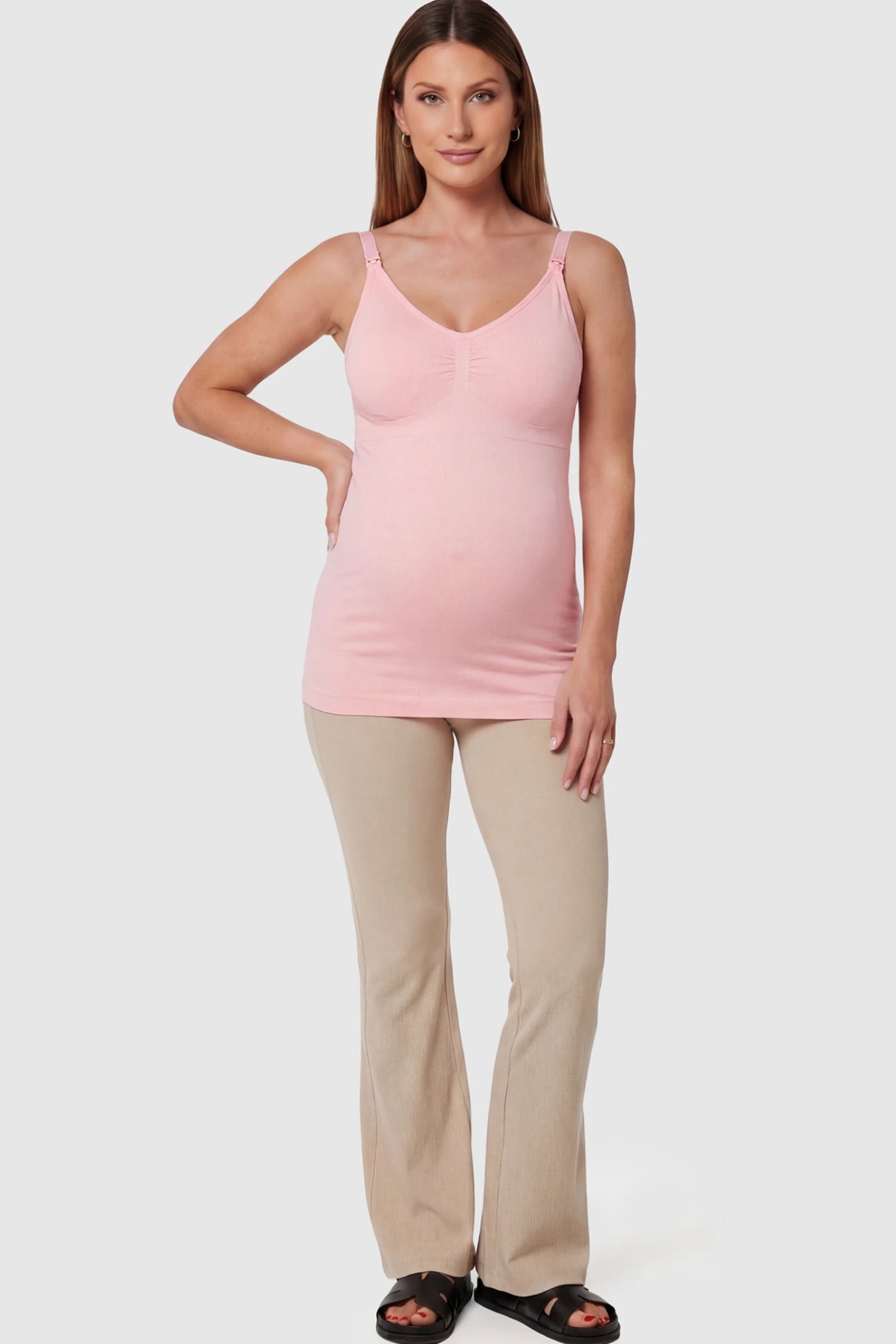Solid Seamless Maternity & Nursing Camisole Solid Seamless Maternity & Nursing Camisole in Pink featuring one-handed nursing clips on a pregnant model.