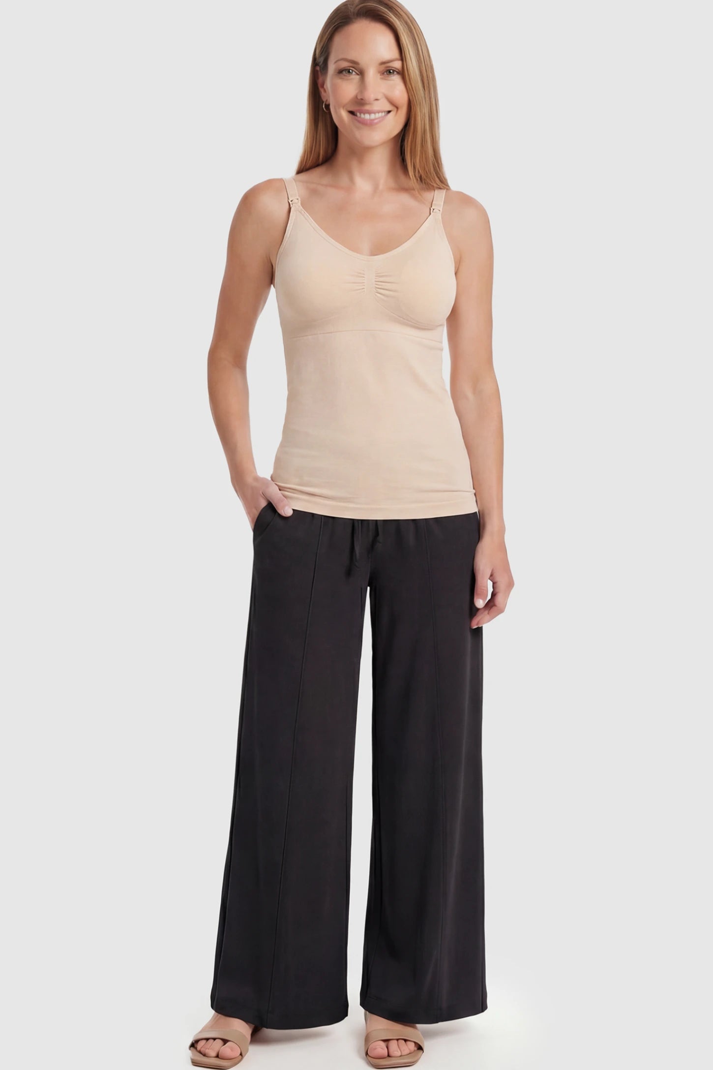 Solid Seamless Maternity & Nursing Camisole Solid Seamless Maternity & Nursing Camisole in Skin featuring one-handed nursing clips on a postpartum model.