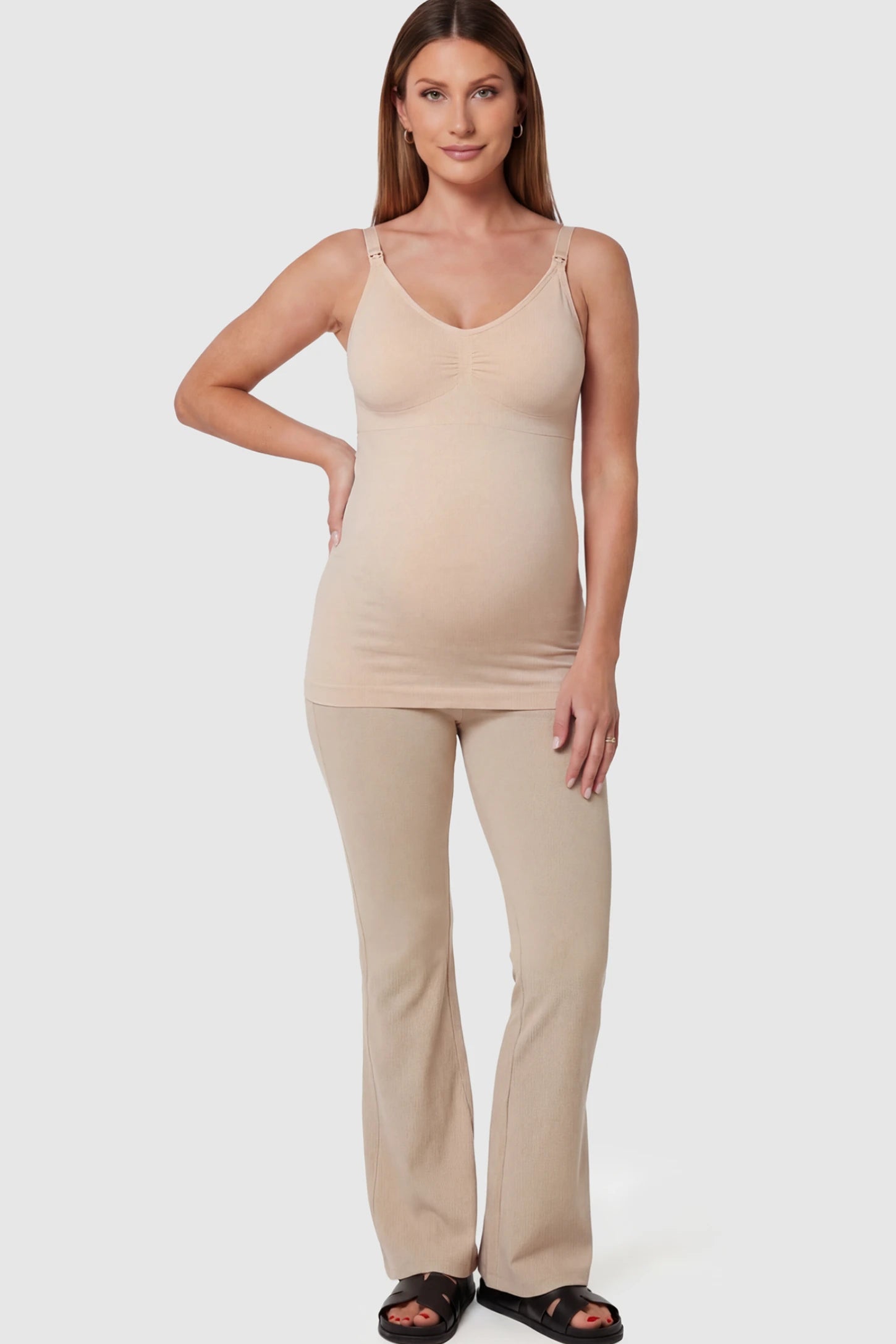 Solid Seamless Maternity & Nursing Camisole Solid Seamless Maternity & Nursing Camisole in Skin featuring one-handed nursing clips on a pregnant model.