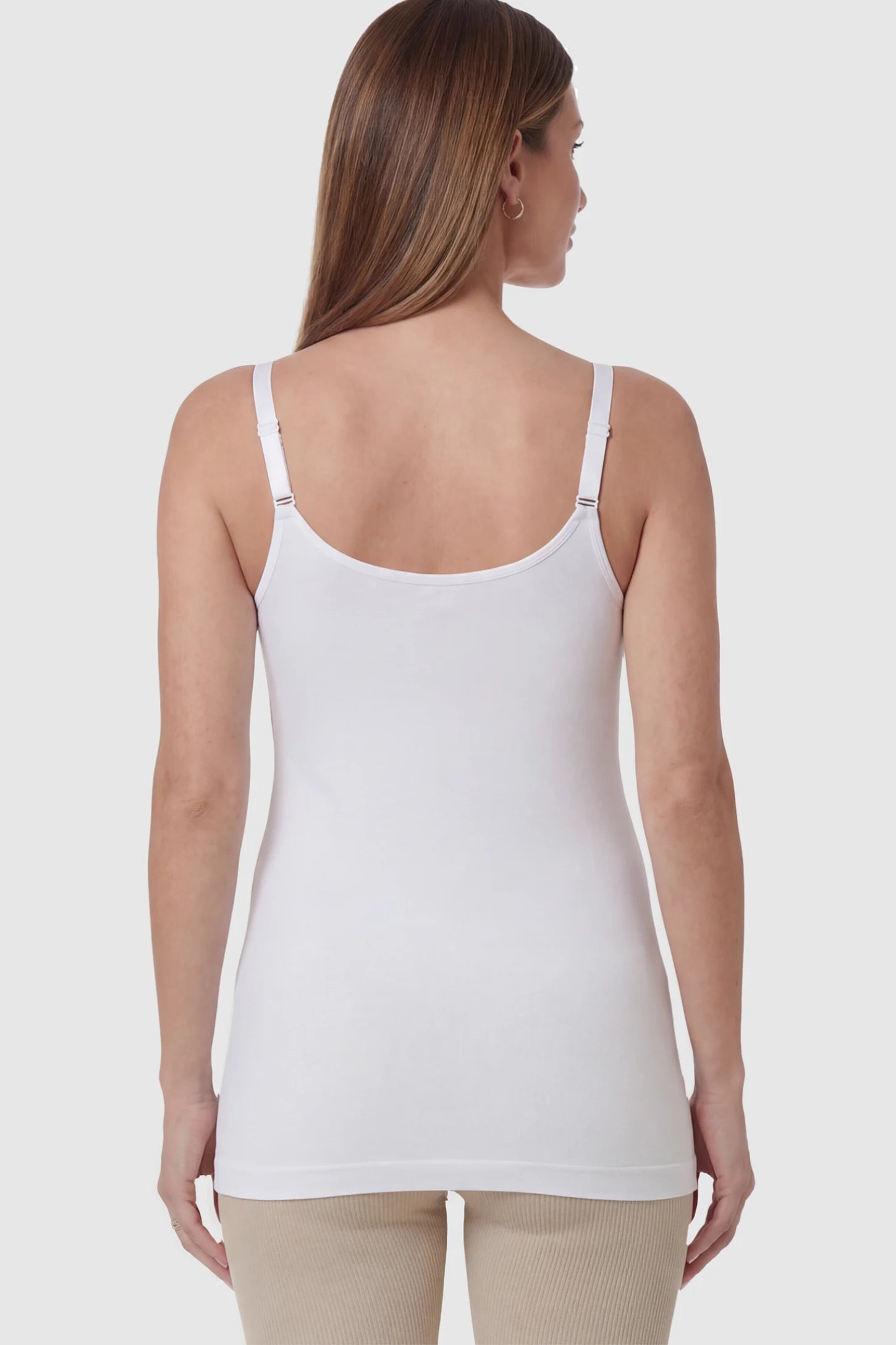 Solid Seamless Maternity & Nursing Camisole Solid Seamless Maternity & Nursing Camisole in White on a pregnant model.