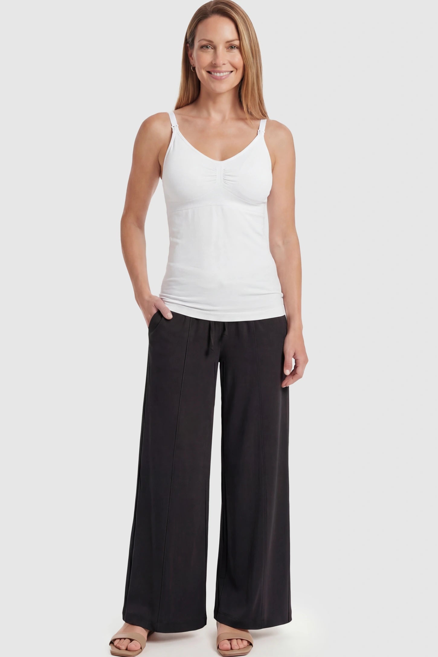 Solid Seamless Maternity & Nursing Camisole Solid Seamless Maternity & Nursing Camisole in White featuring one-handed nursing clips on a postpartum model.