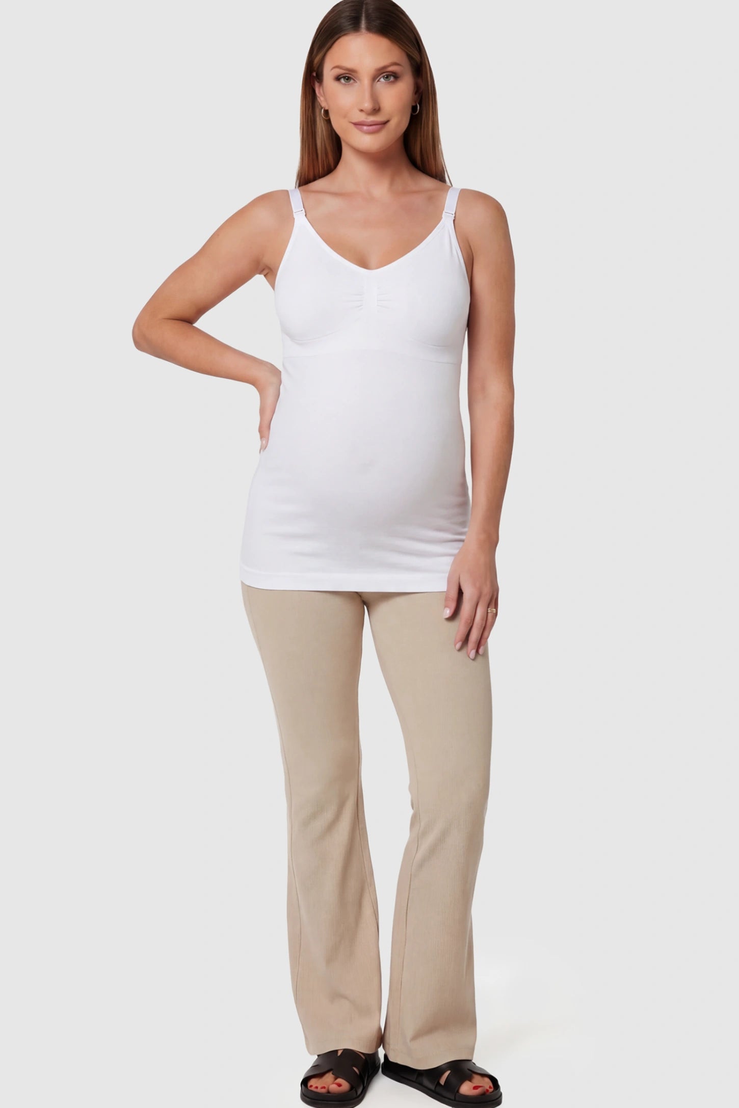 Solid Seamless Maternity & Nursing Camisole Solid Seamless Maternity & Nursing Camisole in White featuring one-handed nursing clips on a pregnant model.