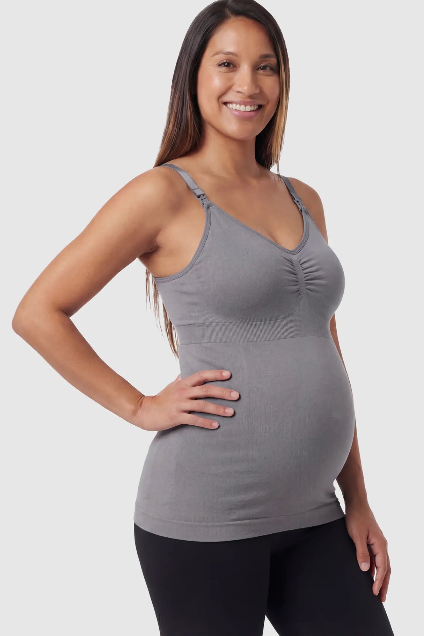 Solid Seamless Maternity & Nursing Camisole Solid Seamless Maternity & Nursing Camisole in Baili Gray featuring one-handed nursing clips on a pregnant model.