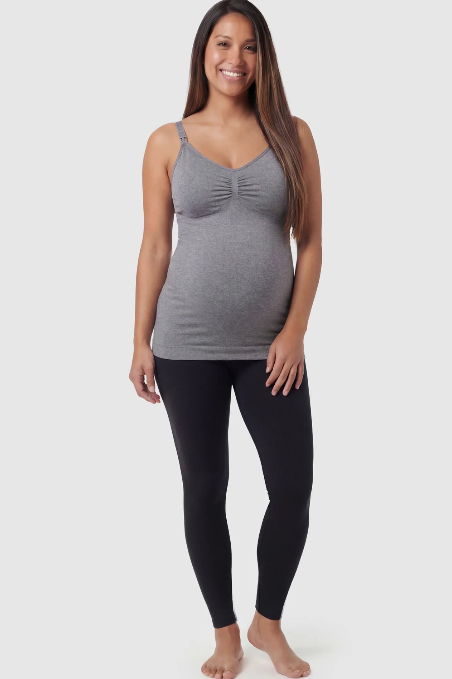 Solid Seamless Maternity & Nursing Camisole Solid Seamless Maternity & Nursing Camisole in Baili Gray featuring one-handed nursing clips on a pregnant model.