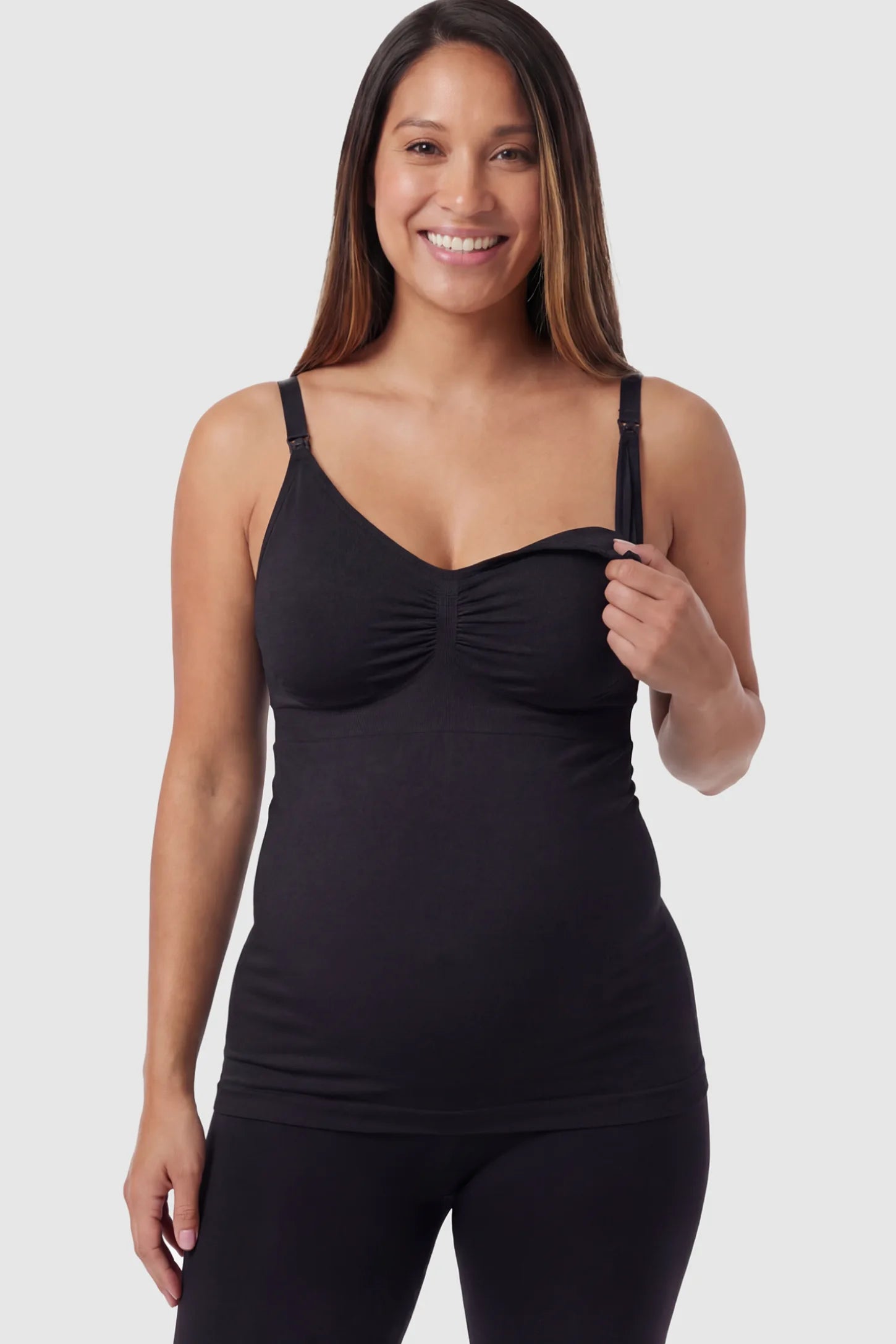 Solid Seamless Maternity & Nursing Camisole Solid Seamless Maternity & Nursing Camisole in Black featuring one-handed nursing clips on a pregnant model.