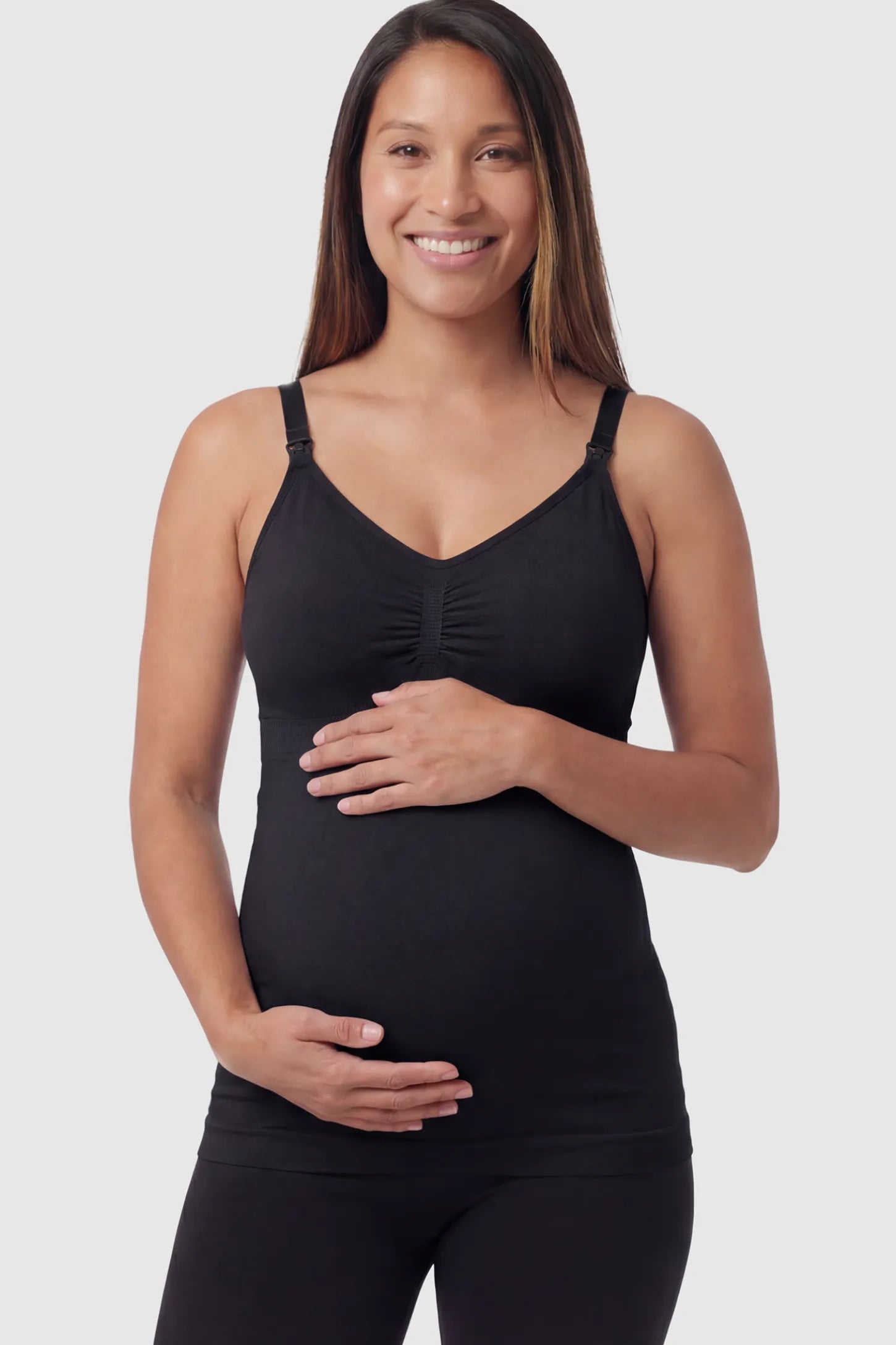 Solid Seamless Maternity & Nursing Camisole Solid Seamless Maternity & Nursing Camisole in Black featuring one-handed nursing clips on a pregnant model.