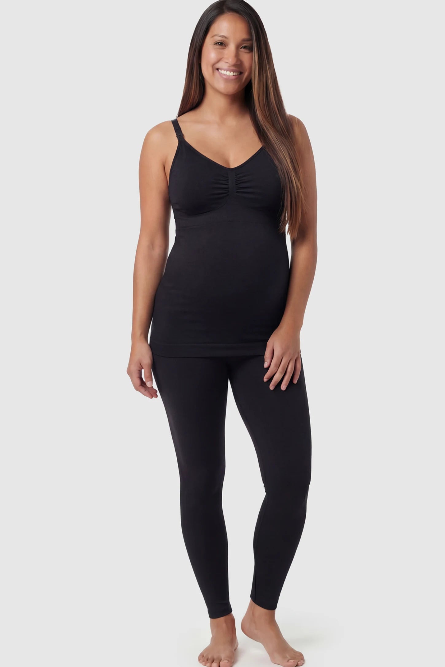 Solid Seamless Maternity & Nursing Camisole Solid Seamless Maternity & Nursing Camisole in Black featuring one-handed nursing clips on a pregnant model.