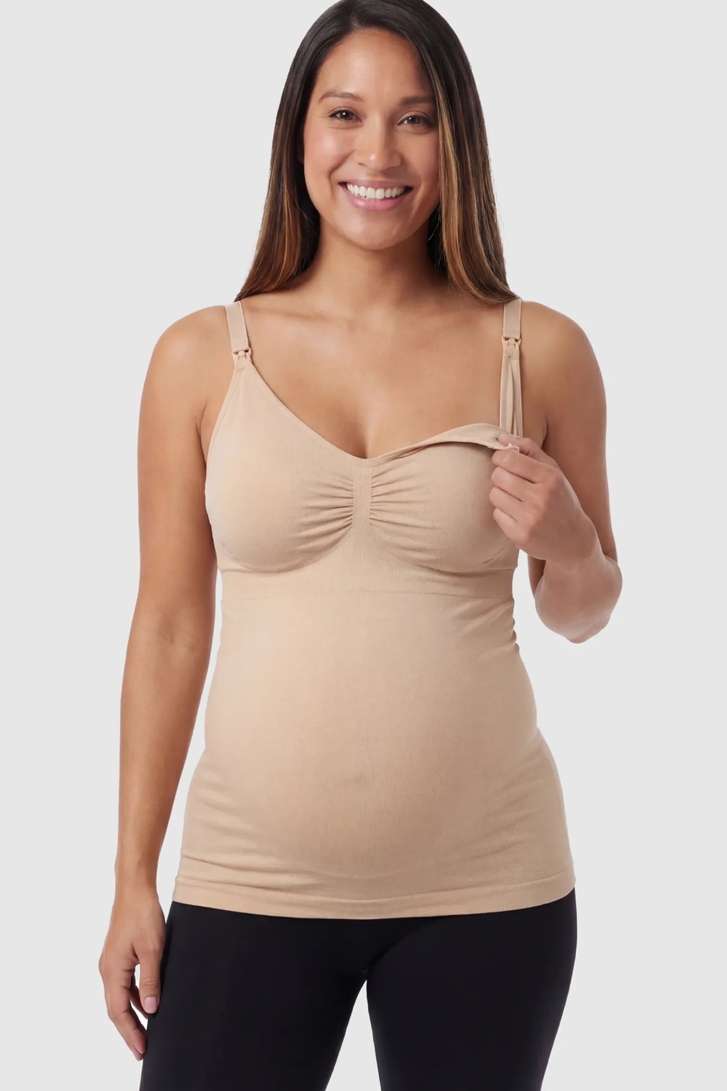 Solid Seamless Maternity & Nursing Camisole Solid Seamless Maternity & Nursing Camisole in Nude featuring one-handed nursing clips on a pregnant model.