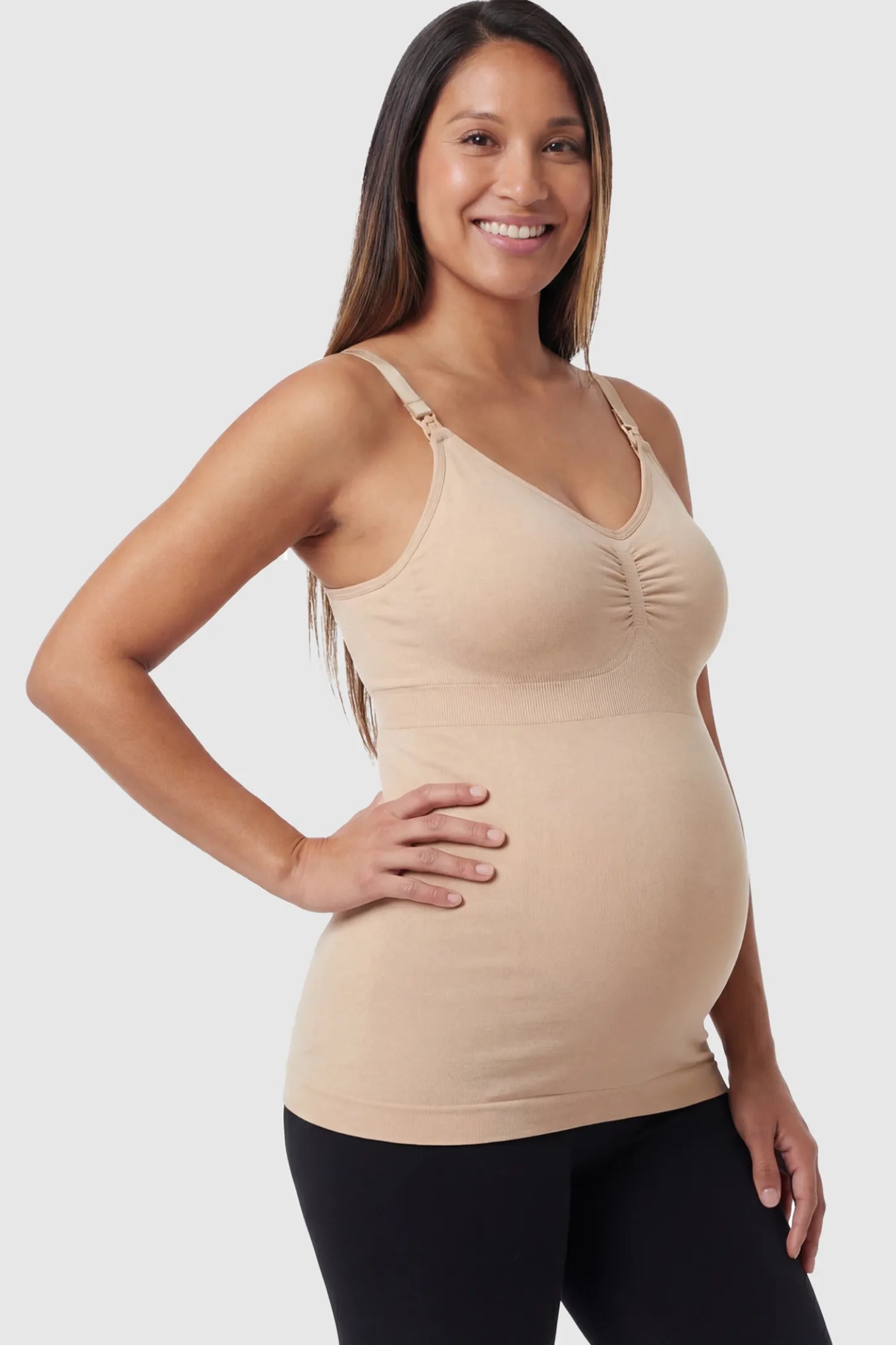 Solid Seamless Maternity & Nursing Camisole in Nude featuring one-handed nursing clips on a pregnant model.
