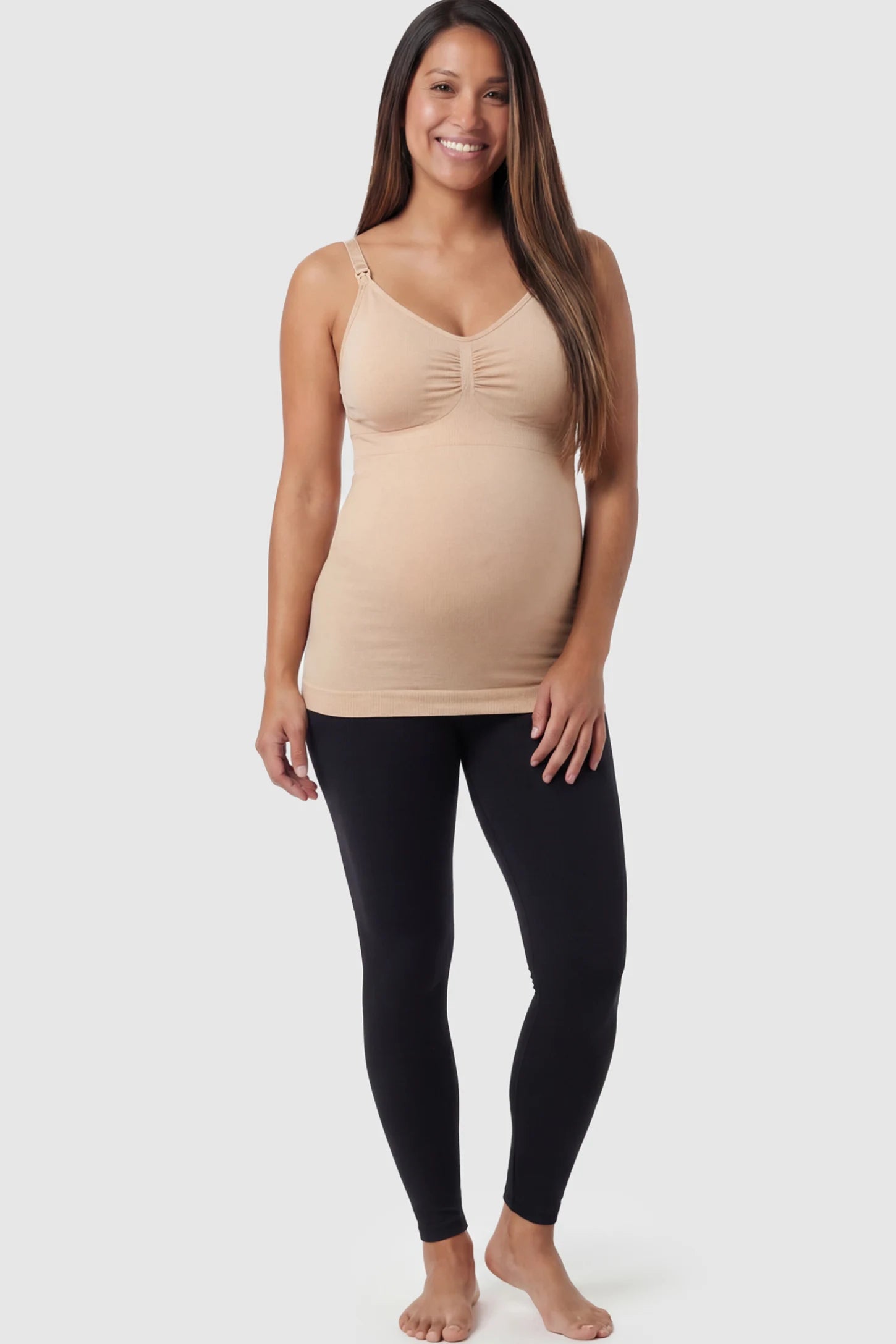Solid Seamless Maternity & Nursing Camisole Solid Seamless Maternity & Nursing Camisole in Nude featuring one-handed nursing clips on a pregnant model.