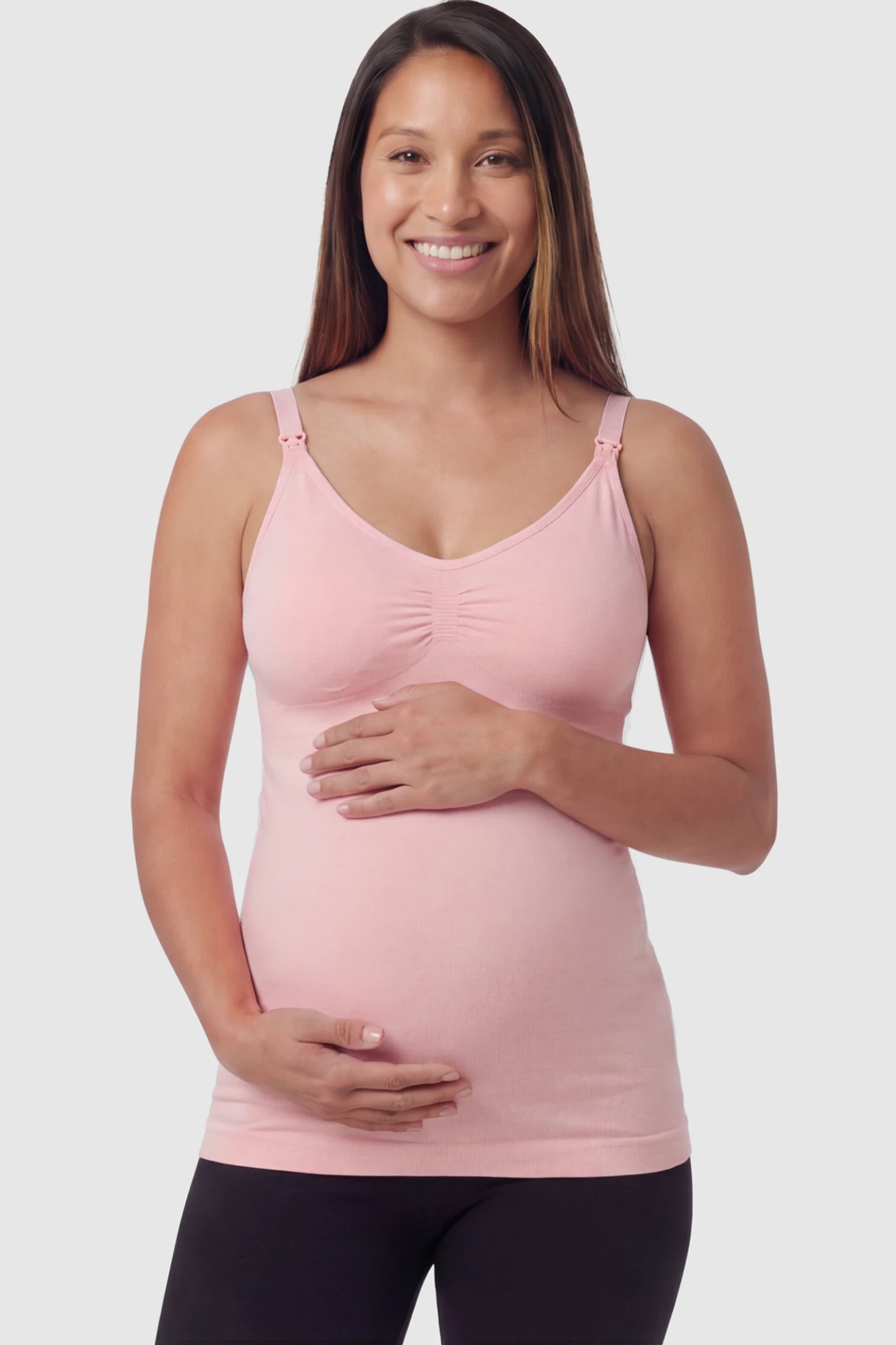 Solid Seamless Maternity & Nursing Camisole Solid Seamless Maternity & Nursing Camisole in Pink featuring one-handed nursing clips on a pregnant model.