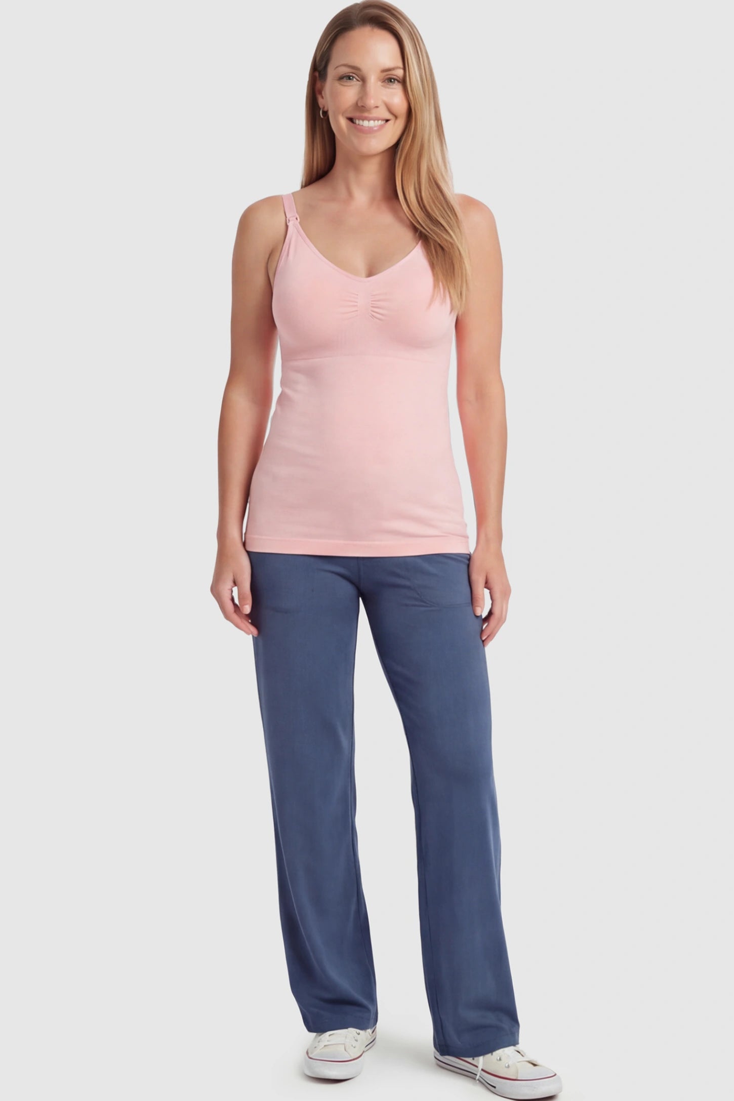 Solid Seamless Maternity & Nursing Camisole Solid Seamless Maternity & Nursing Camisole in Pink featuring one-handed nursing clips on a postpartum model.
