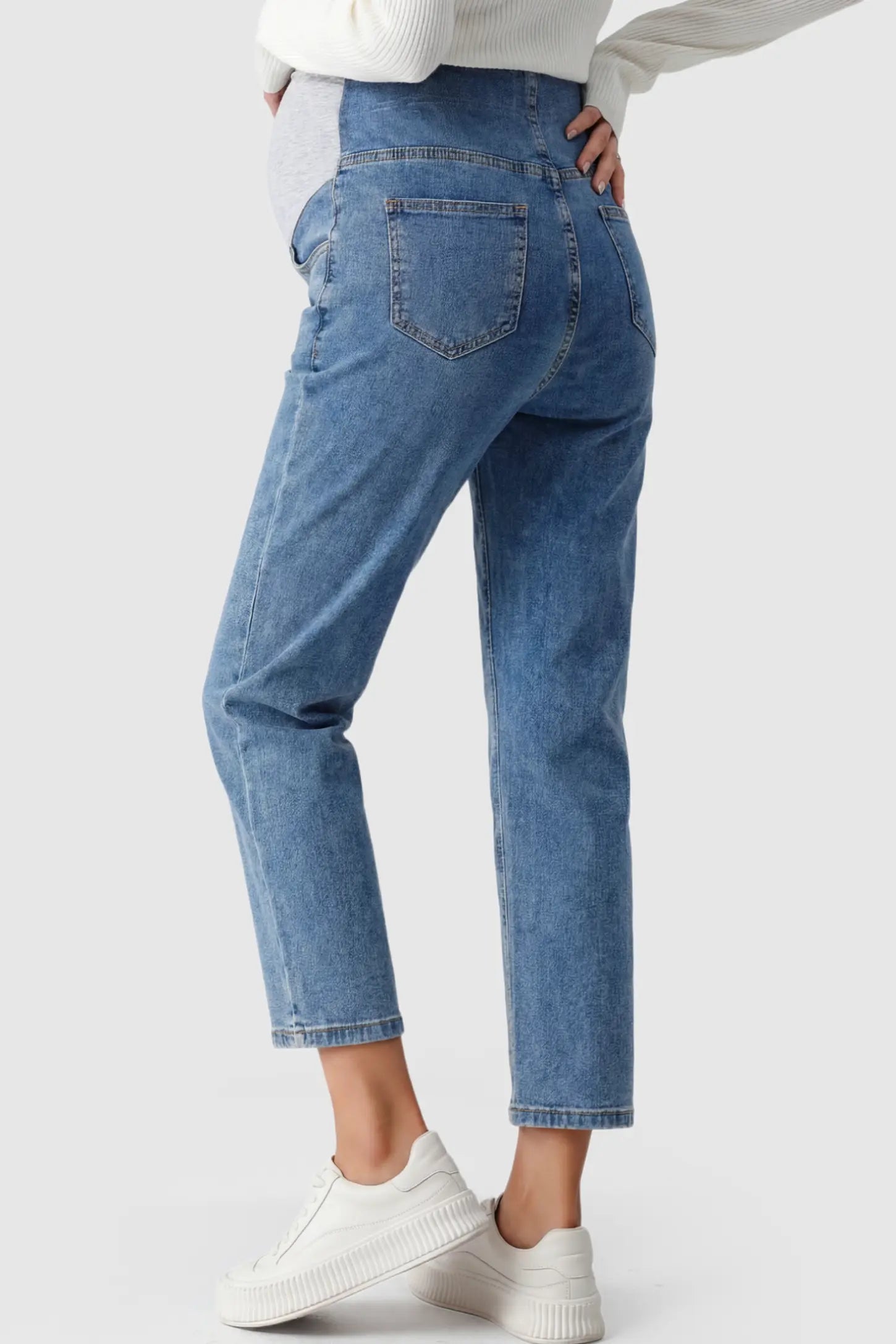 Elastic Full Panel Straight Leg Maternity Jeans Elastic Full Panel Straight Leg Maternity Jeans in Denim Blue on a pregnant model.