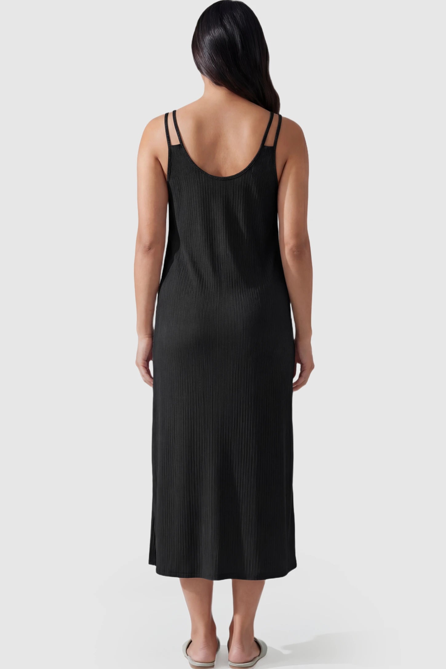 Double-Strap Sleeveless Maternity Slip Dress Double-Strap Sleeveless Maternity Slip Dress in black ribbed knit fabric on a pregnant model.