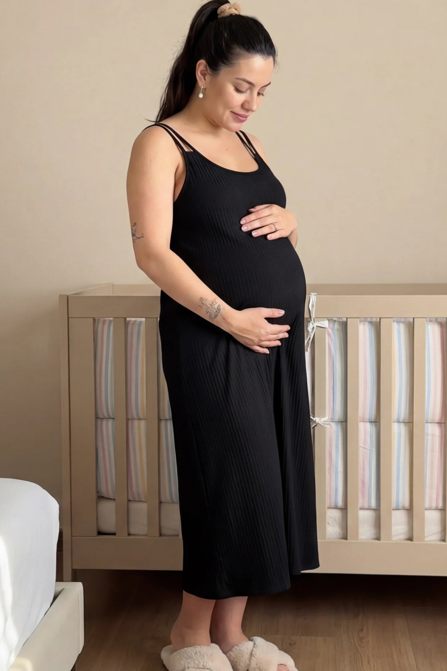 Double-Strap Sleeveless Maternity Slip Dress in black ribbed knit fabric on a pregnant model.