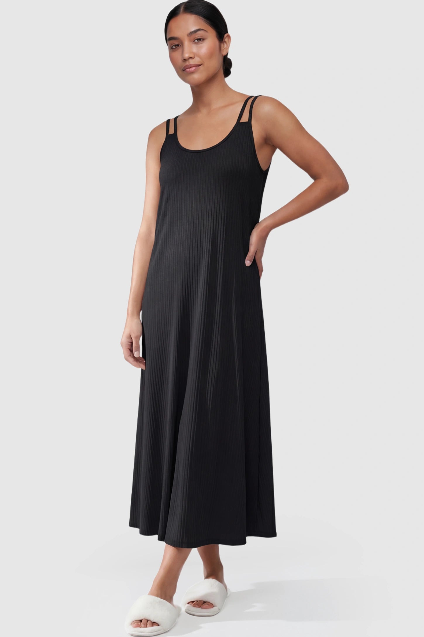 Double-Strap Sleeveless Maternity Slip Dress Double-Strap Sleeveless Maternity Slip Dress in black ribbed knit fabric on a postpartum model.
