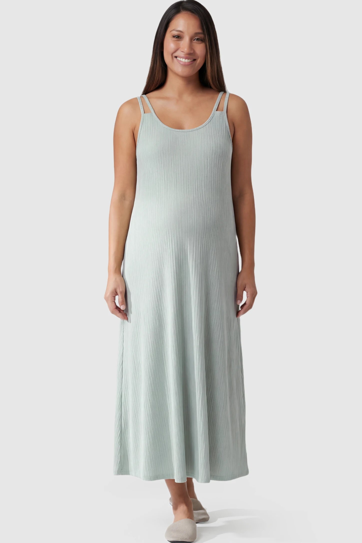 Double-Strap Sleeveless Maternity Slip Dress Double-Strap Sleeveless Maternity Slip Dress in Light Green ribbed knit fabric on a pregnant model.