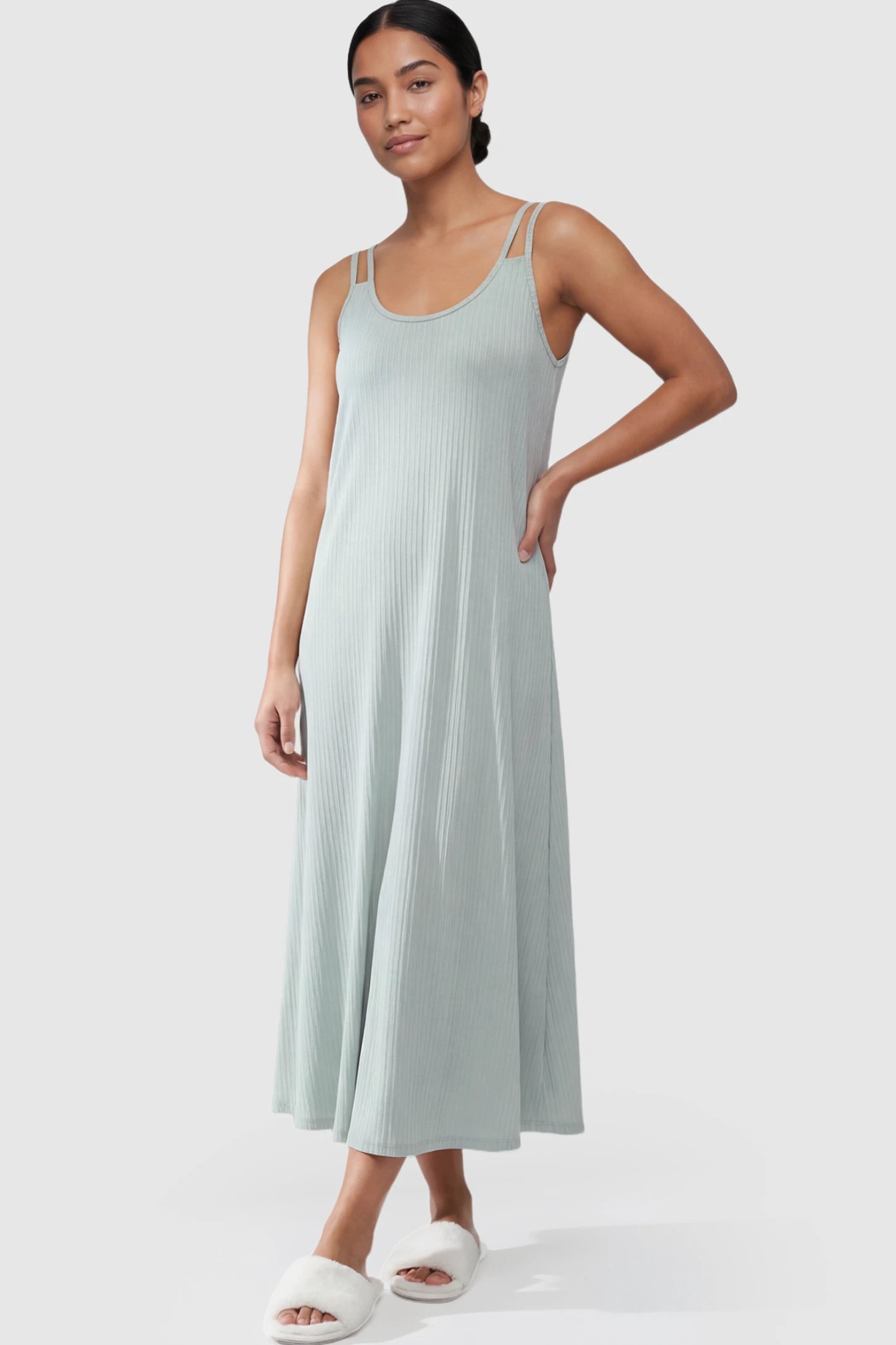 Double-Strap Sleeveless Maternity Slip Dress Double-Strap Sleeveless Maternity Slip Dress in Light Green ribbed knit fabric on a postpartum model.