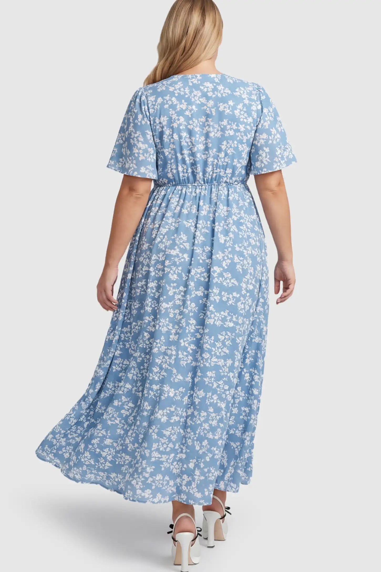 Floral V-Neck Side-Slit Maternity Maxi Dress Floral V-Neck Side-Slit Maternity Maxi Dress in blue on a pregnant model.