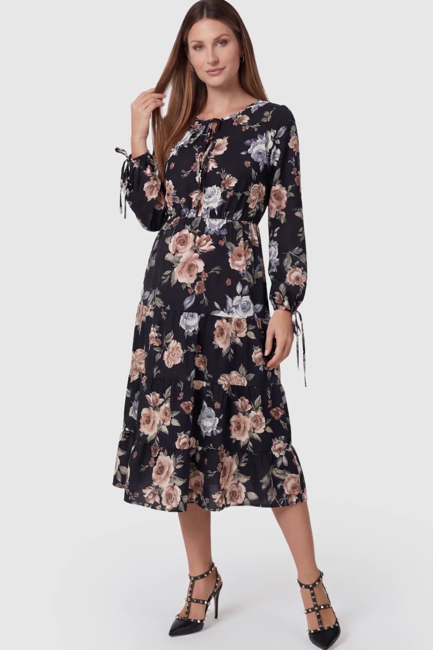 Floral Print Tiered Midi Maternity Dress in dark floral featuring adjustable tie-cuff sleeves on a model.