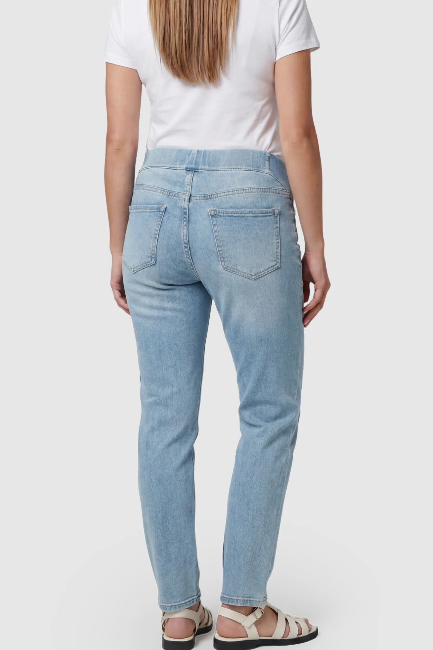 Full Panel Wide Leg Maternity Jeans Full Panel Wide Leg Maternity Jeans in light Blue featuring a seamless tummy-support band on a pregnant model showing back.