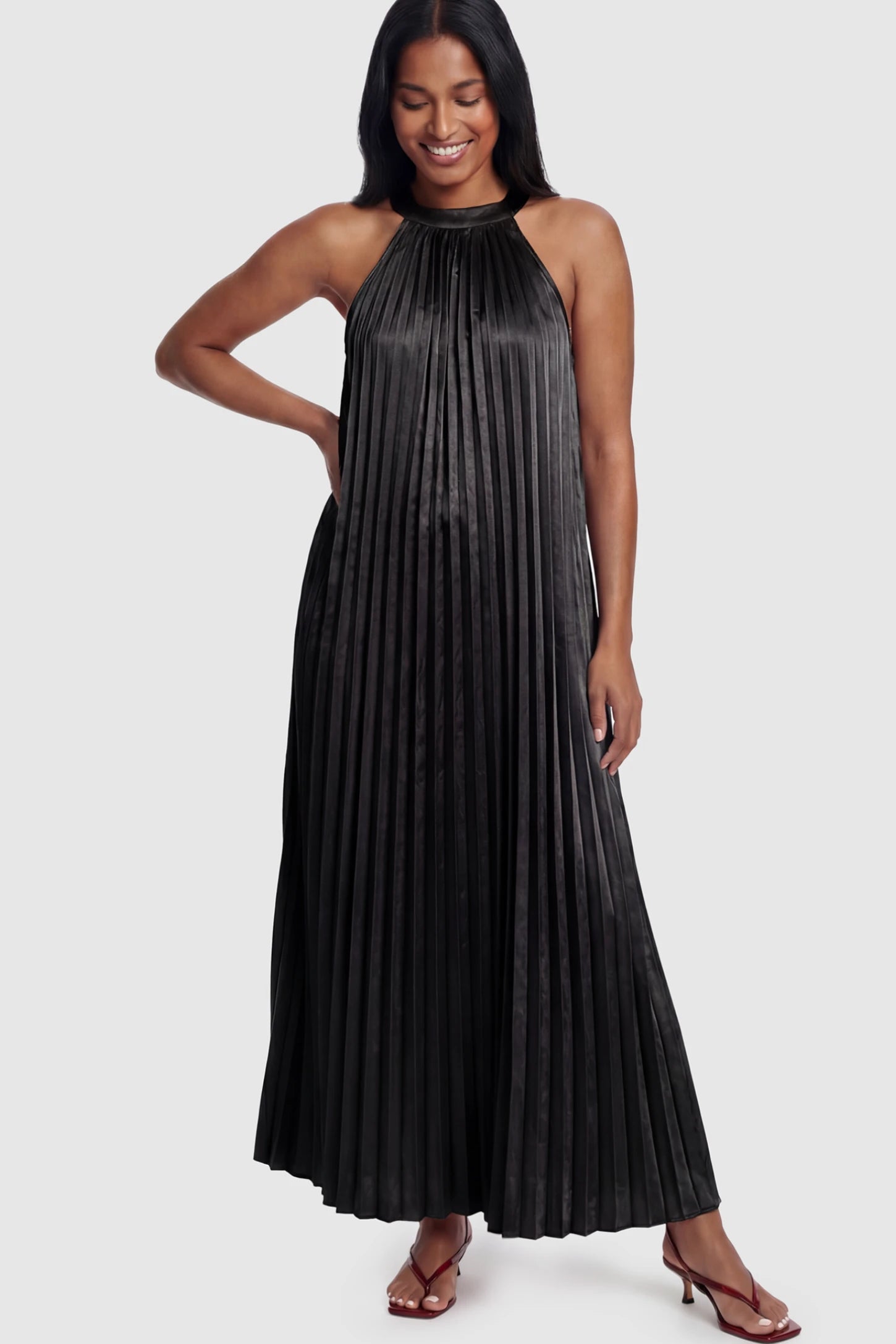 Pleated Faux Silk Halter Maternity Maxi Dress Pleated Faux Silk Halter Maternity Maxi Dress in Black featuring micro-pleat texture on a postpartum model facing front.