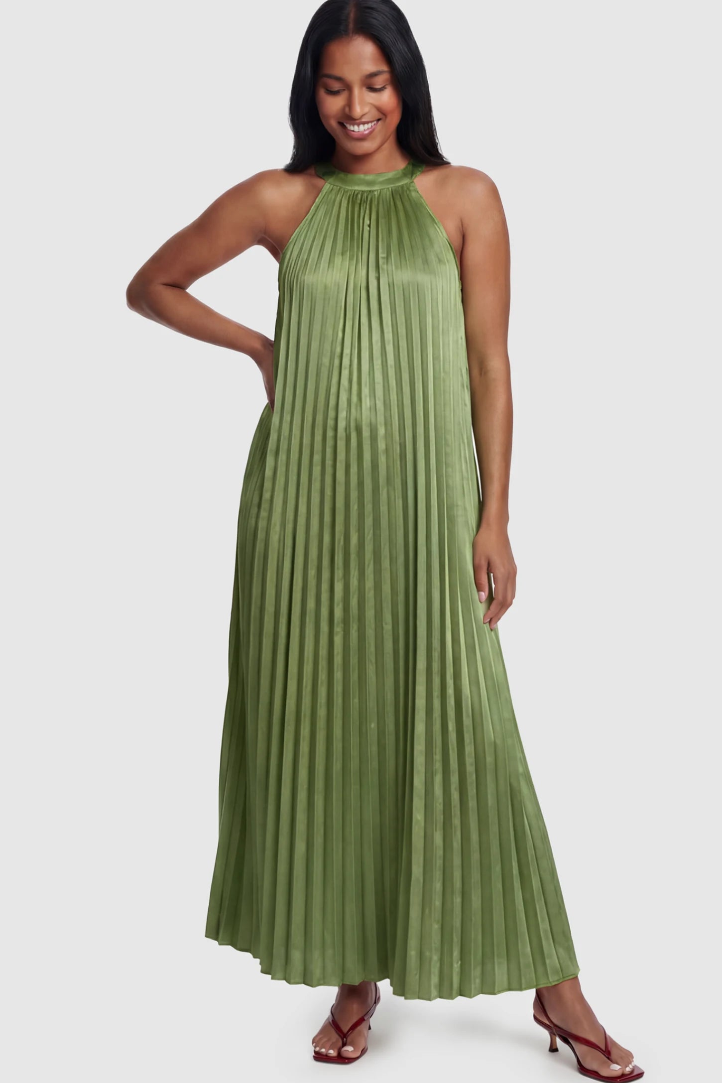 Pleated Faux Silk Halter Maternity Maxi Dress Pleated Faux Silk Halter Maternity Maxi Dress in Green featuring micro-pleat texture on a postpartum model facing front.