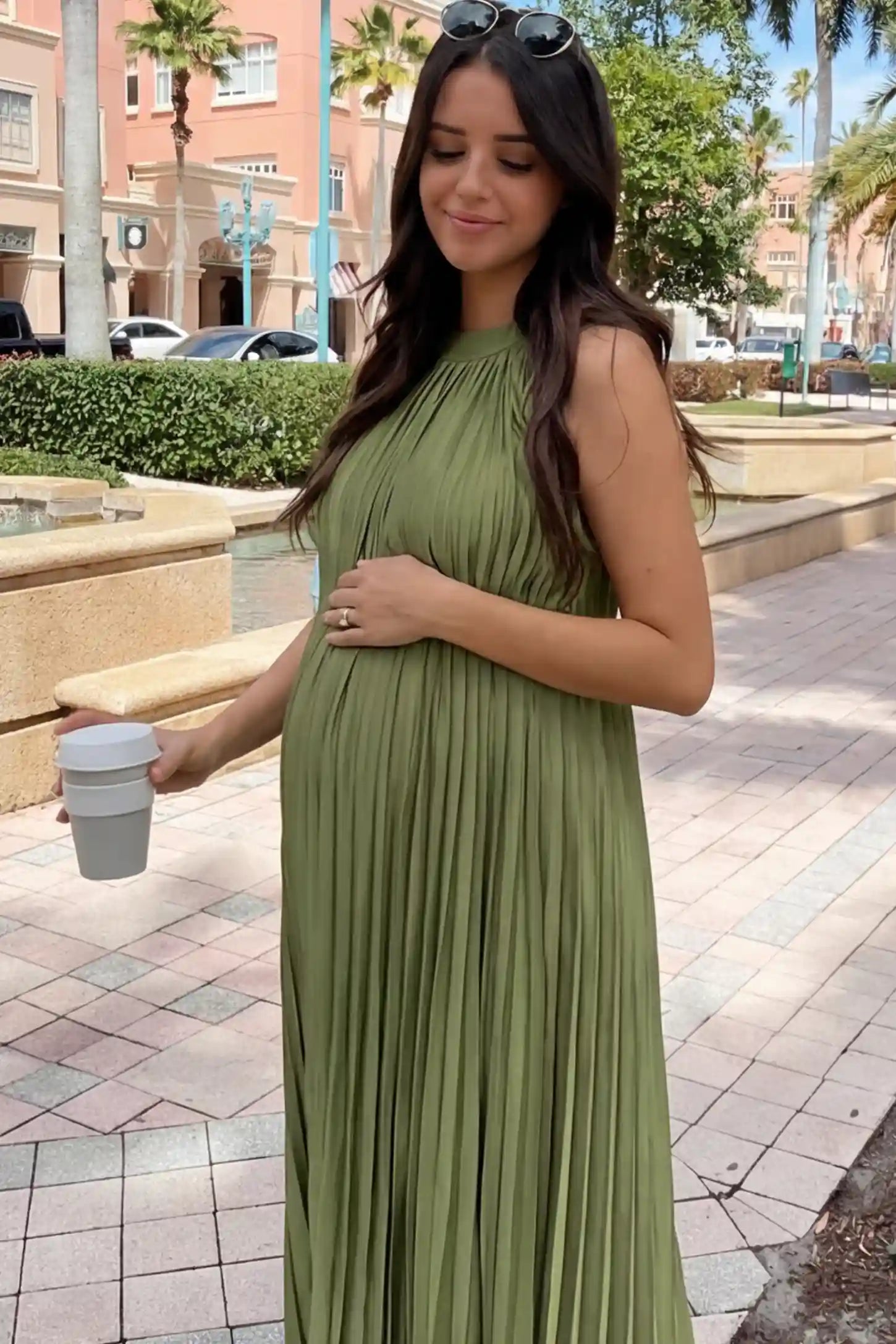 Pleated Faux Silk Halter Maternity Maxi Dress Pleated Faux Silk Halter Maternity Maxi Dress in Green featuring micro-pleat texture on a pregnant model.