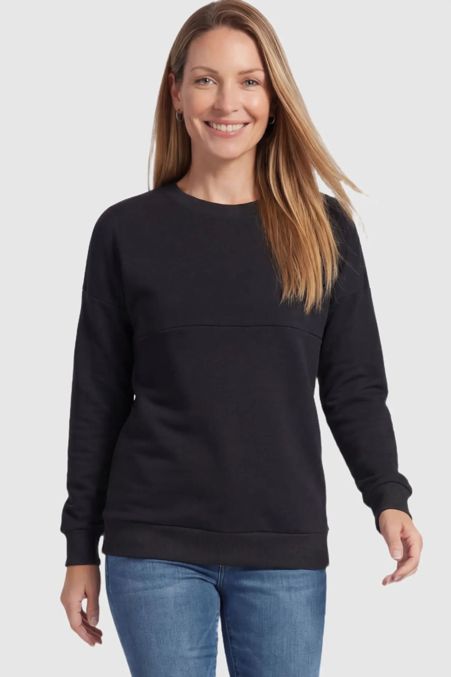 Solid Long Sleeve Pullover Maternity & Nursing Sweatshirt Solid Long Sleeve Pullover Maternity & Nursing Sweatshirt in Black featuring a hidden zip raised seam on a model.