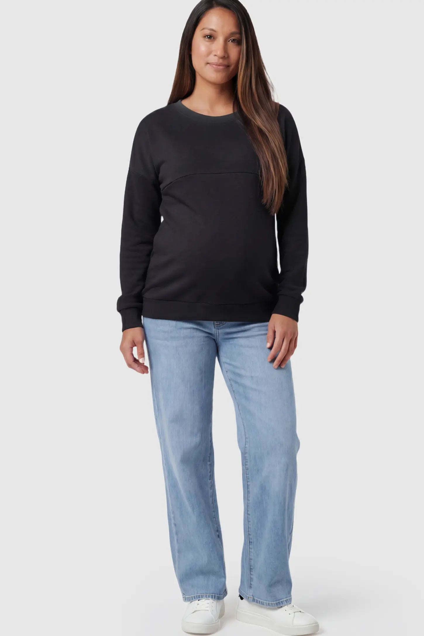 Solid Long Sleeve Pullover Maternity & Nursing Sweatshirt Solid Long Sleeve Pullover Maternity & Nursing Sweatshirt in Black featuring a hidden zip raised seam on a model.
