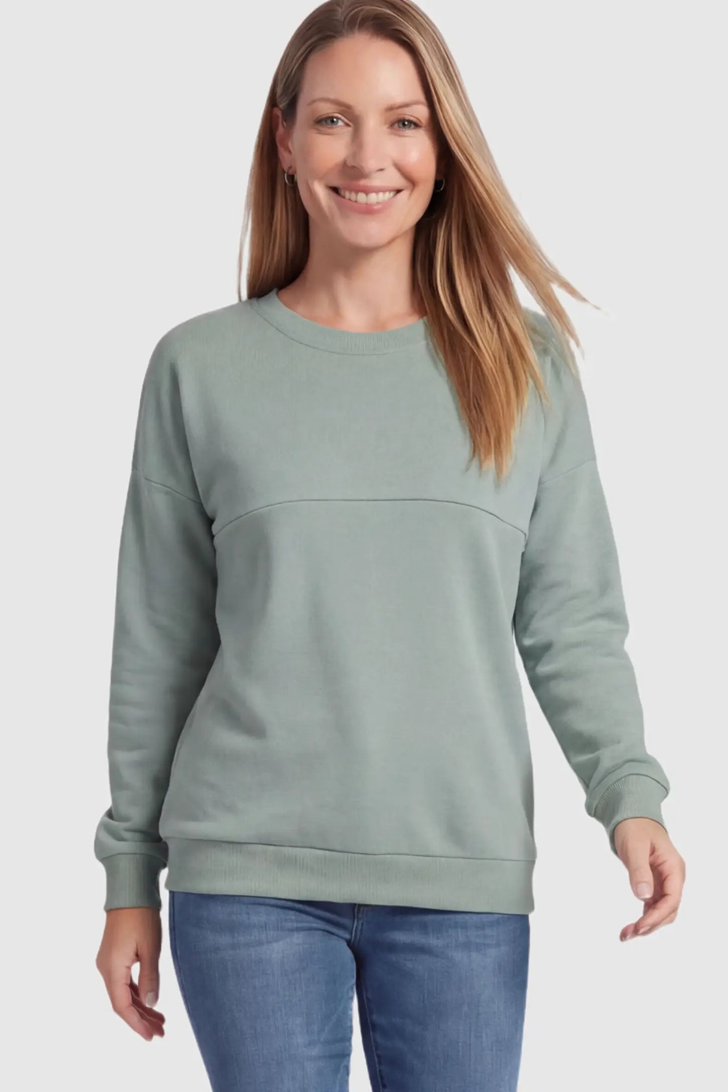 Solid Long Sleeve Pullover Maternity & Nursing Sweatshirt Solid Long Sleeve Pullover Maternity & Nursing Sweatshirt in Sage Green featuring a hidden zip raised seam on a model.