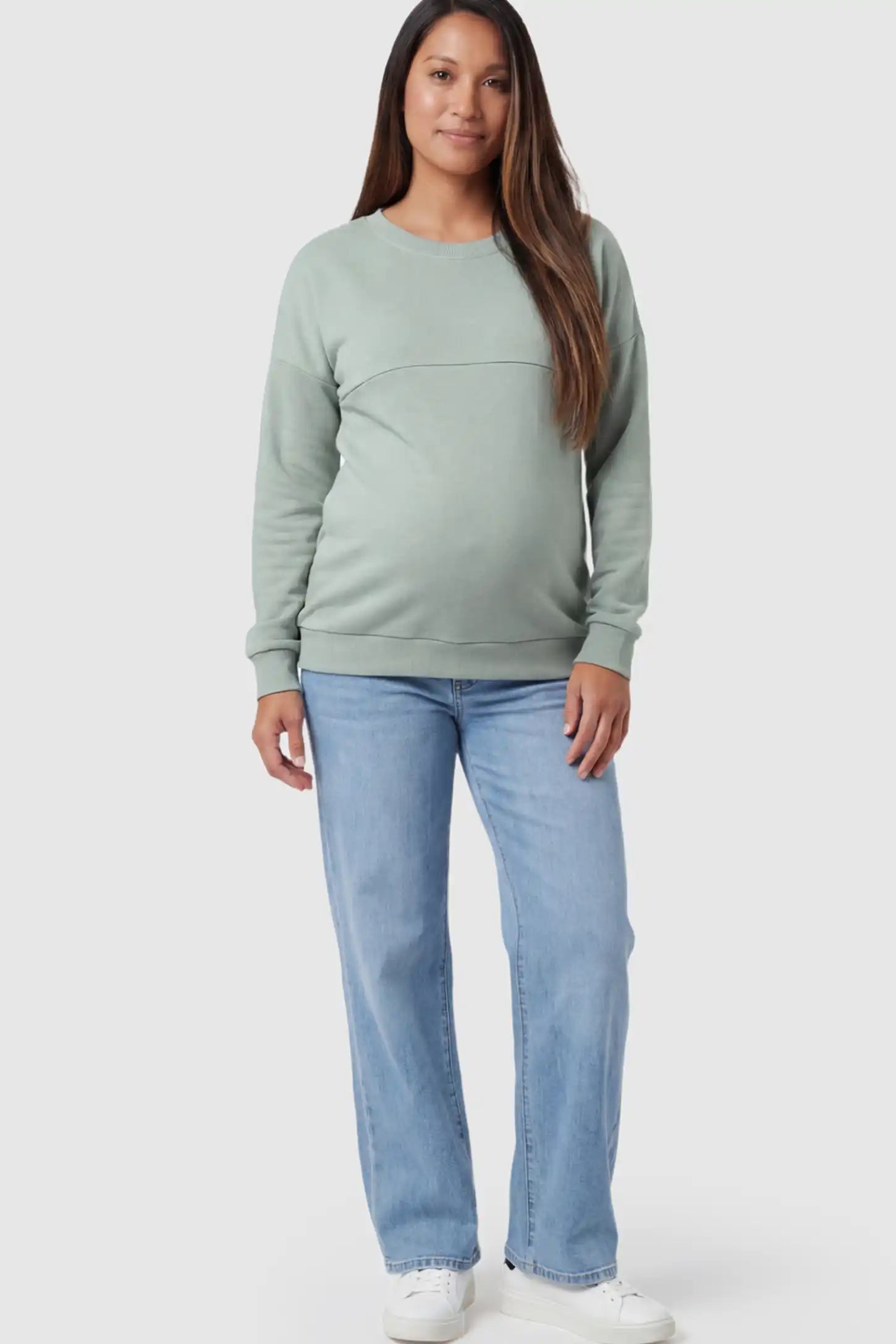 Solid Long Sleeve Pullover Maternity & Nursing Sweatshirt Solid Long Sleeve Pullover Maternity & Nursing Sweatshirt in Sage Green featuring a hidden zip raised seam on a model.
