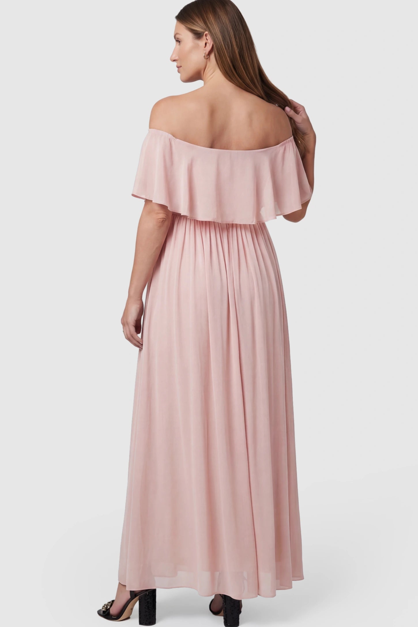Chiffon Off Shoulder Maternity Maxi Dress Chiffon Off-Shoulder Maternity Maxi Dress in Pink featuring a Floor-length on a pregnant model.