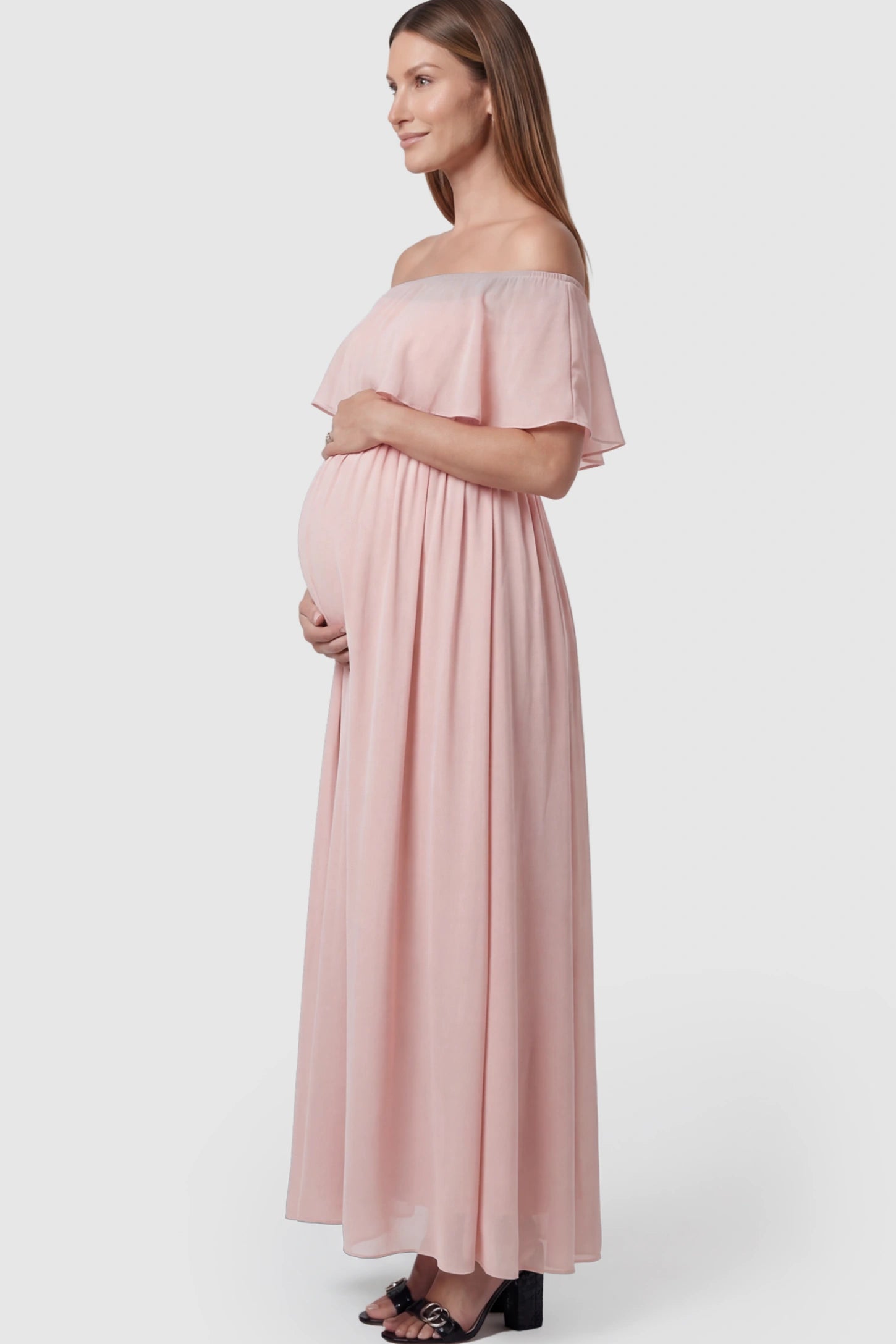 Chiffon Off-Shoulder Maternity Maxi Dress in Pink featuring a Floor-length on a pregnant model.