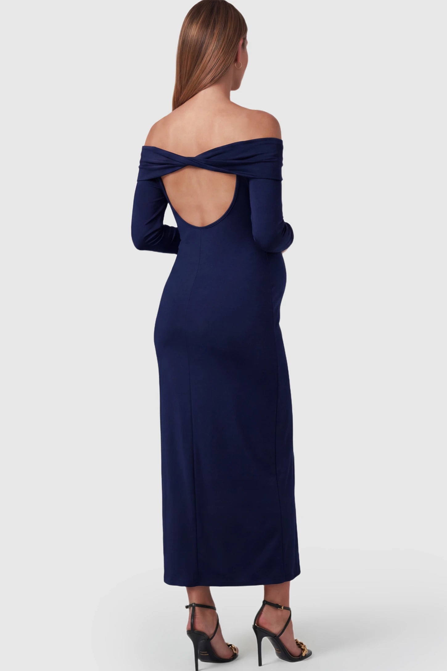 Solid Off Shoulder Bodycon Maternity Maxi Dress Off Shoulder Bodycon Maternity Maxi Dress in Blue featuring a back cutout on a pregnant model.