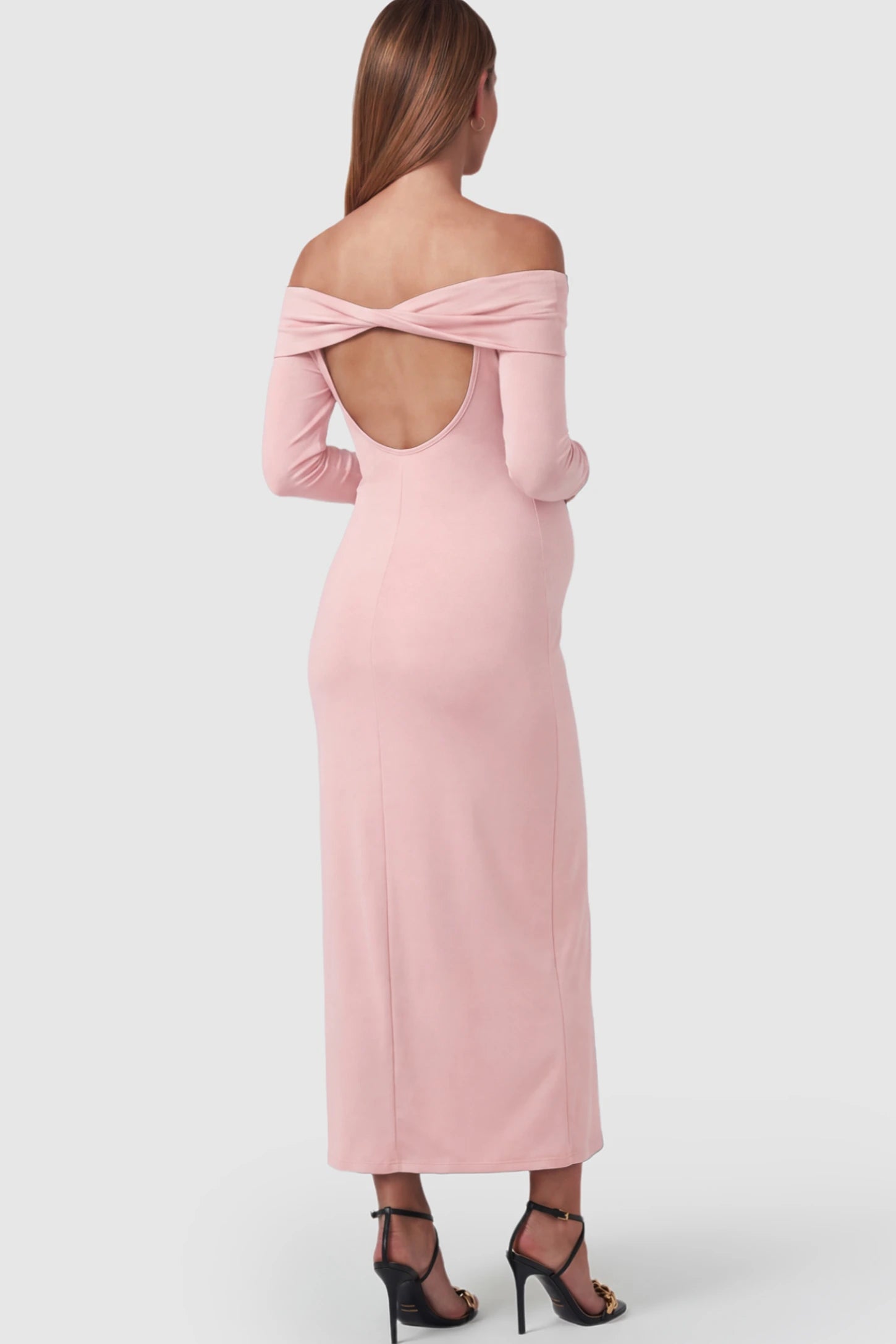 Solid Off Shoulder Bodycon Maternity Maxi Dress Off Shoulder Bodycon Maternity Maxi Dress in Pink featuring a back cutout on a pregnant model.