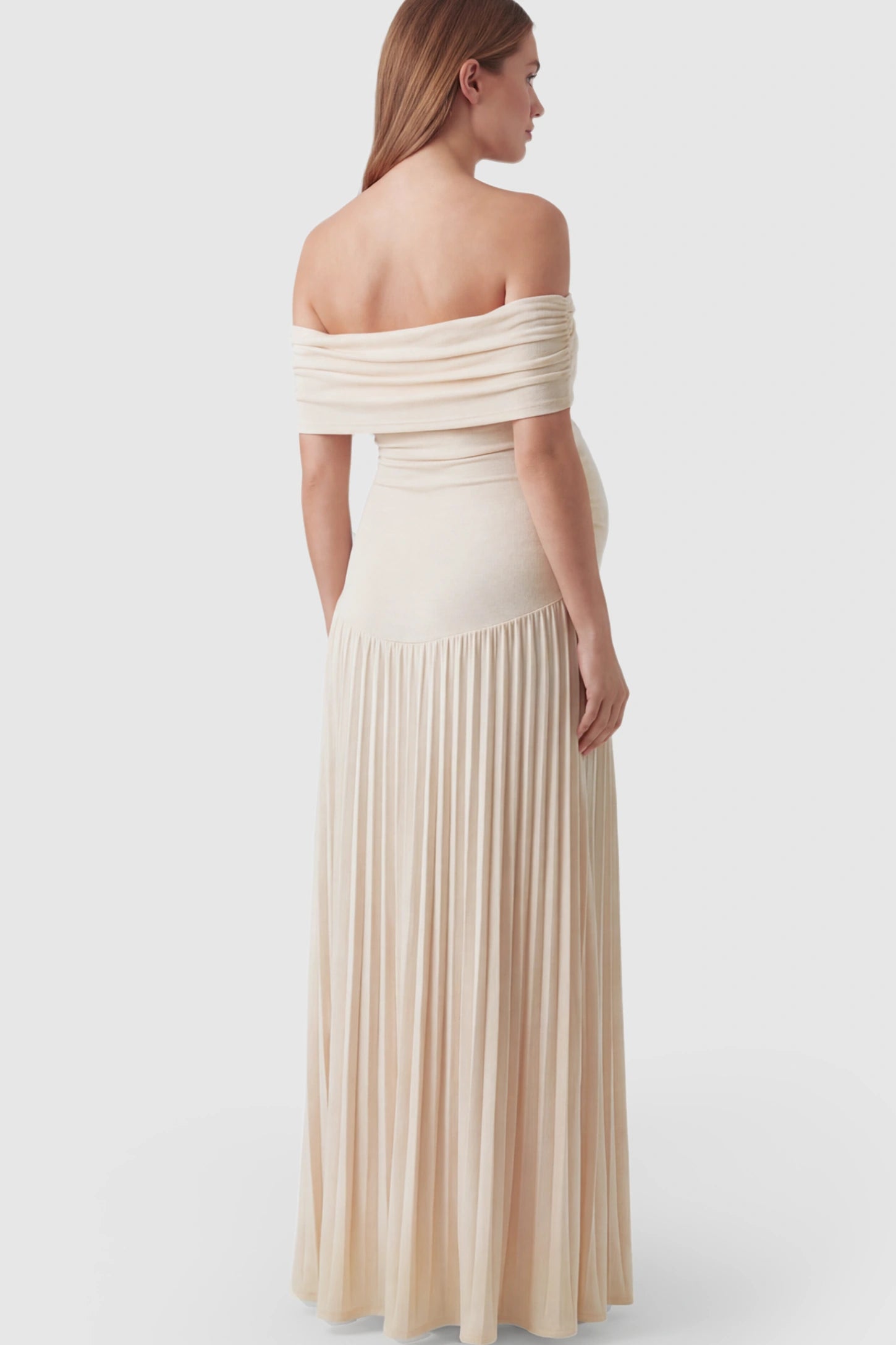 Pleated Off Shoulder Maternity Maxi Dress Pleated Off Shoulder Maternity Maxi Dress in Beige featuring a floor-length silhouette on a pregnant model.