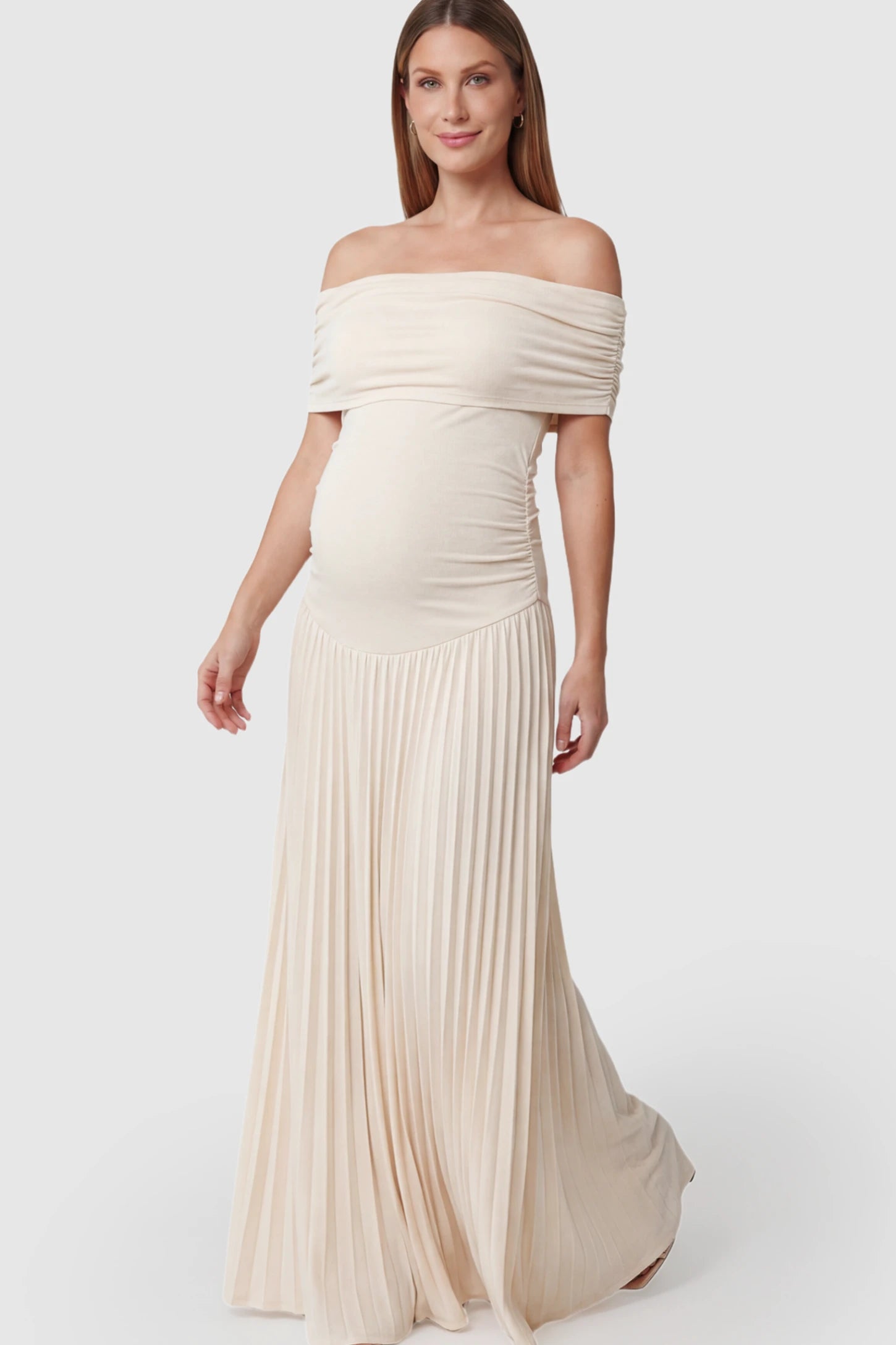 Pleated Off Shoulder Maternity Maxi Dress in Beige featuring a floor-length silhouette on a pregnant model.