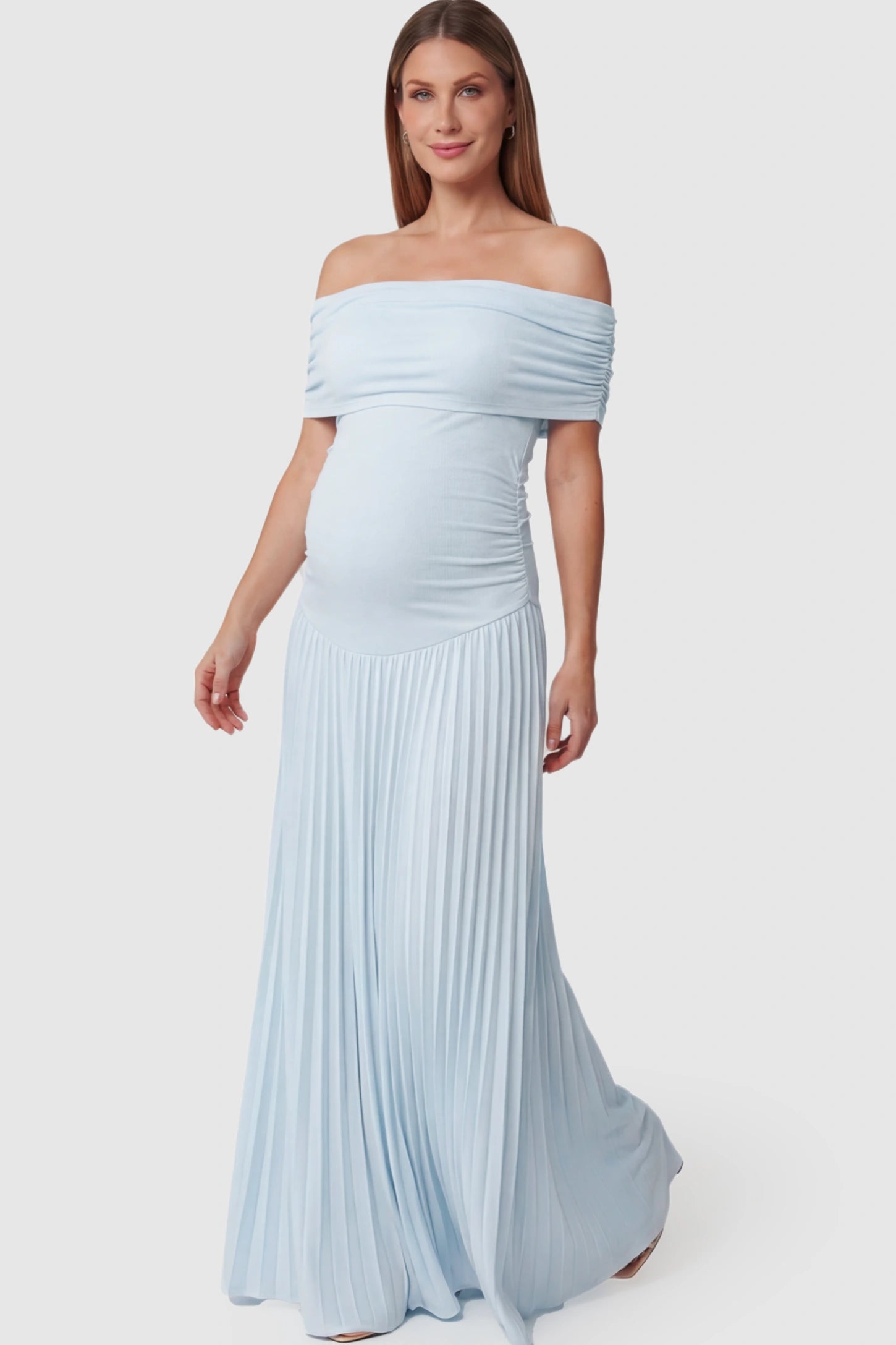 Pleated Off Shoulder Maternity Maxi Dress Pleated Off Shoulder Maternity Maxi Dress in Light Blue featuring a floor-length silhouette on a pregnant model.
